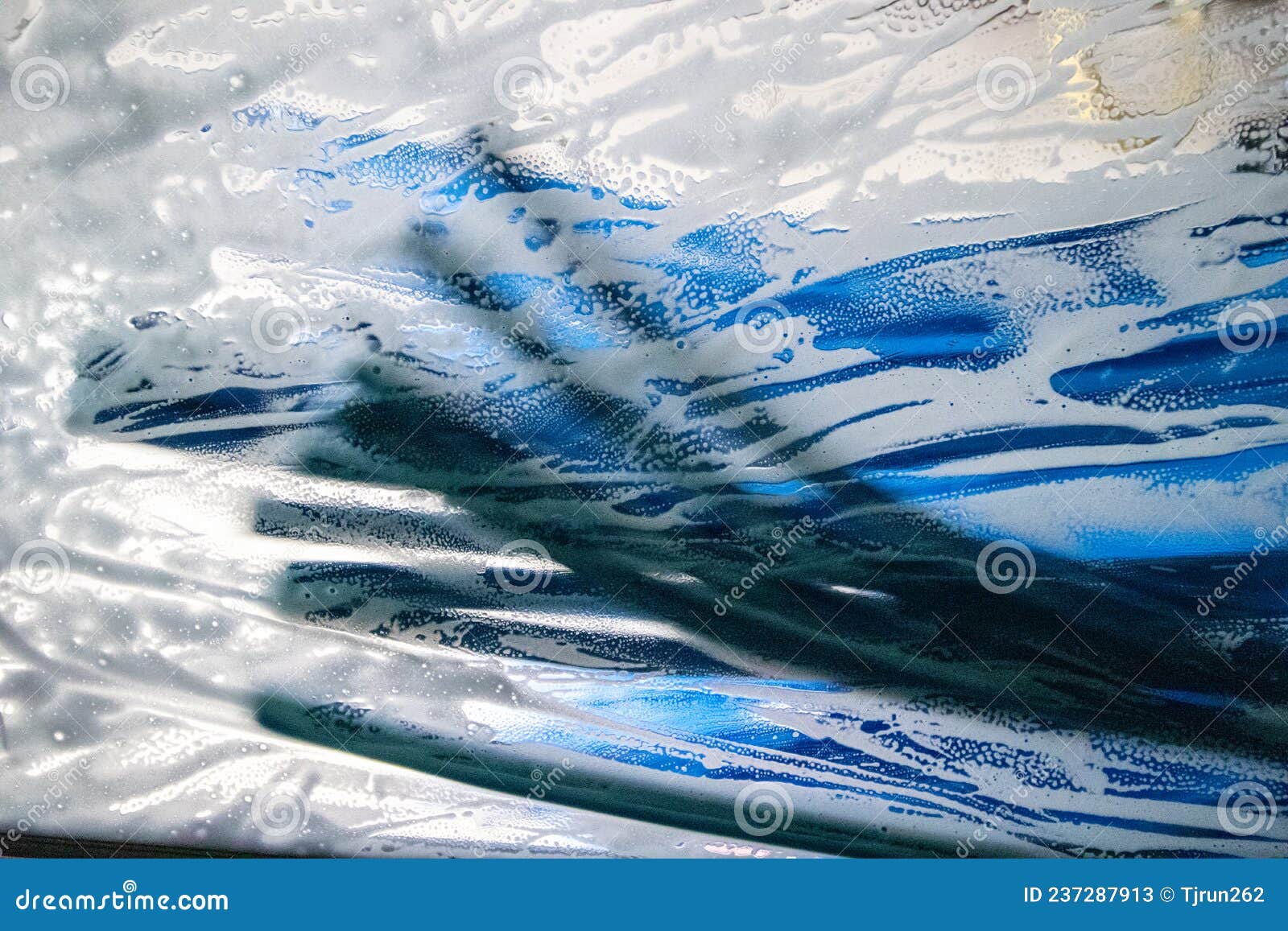 Soap Suds on a Car Windshield in an Automated Car Wash Stock Image