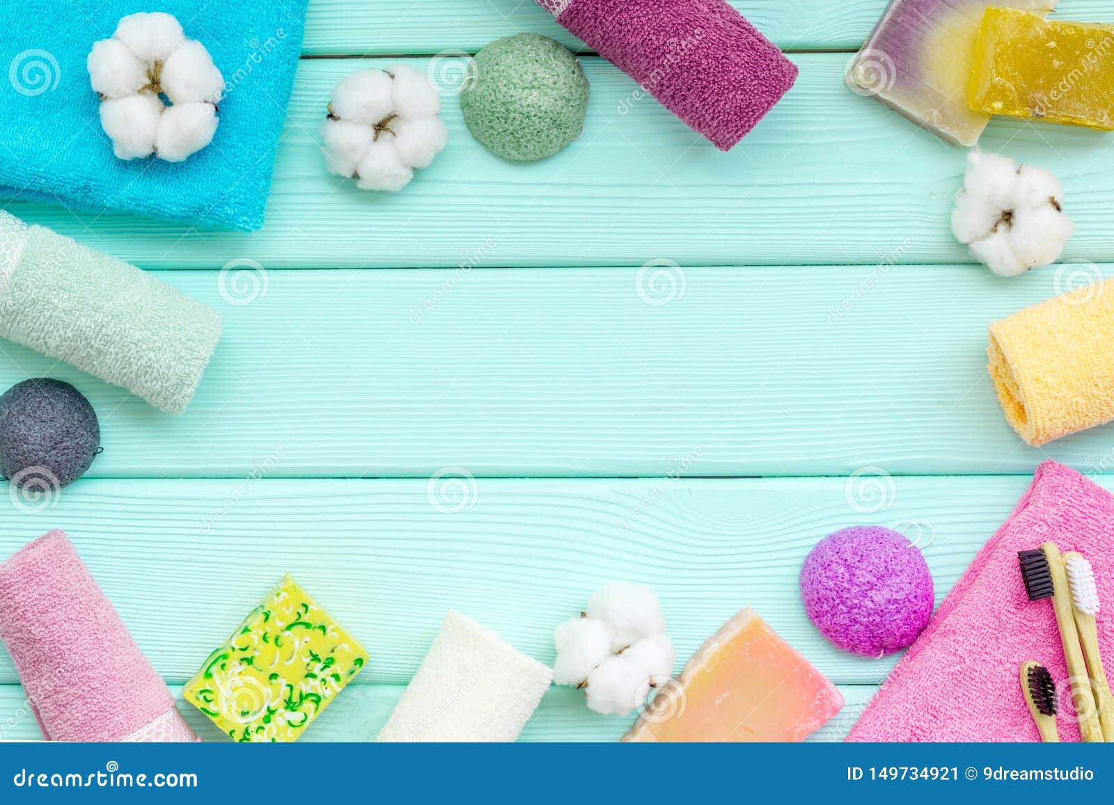 Download Soap, Tooth Brush, Bath Bomb And Cotton Towels For Body Care And Washing On Mint Green Wooden ...