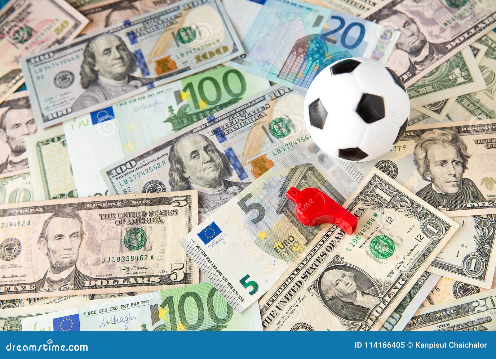 soccer ball over a lot of money. corruption football game. betting and gambling concept.