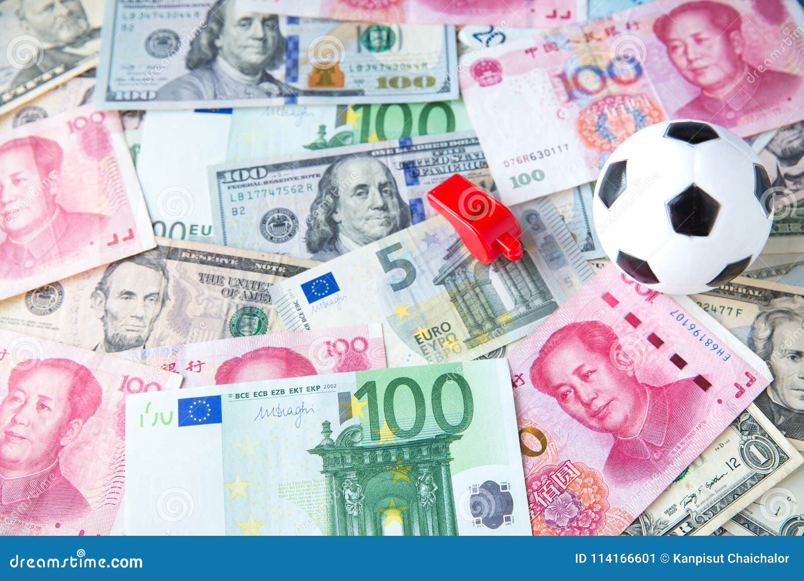 soccer ball over a lot of money. corruption football game. betting and gambling concept.