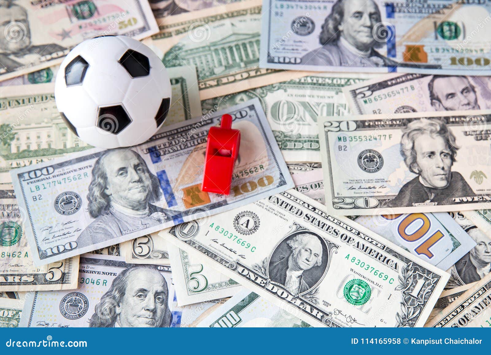soccer ball over a lot of money. corruption football game. betting and gambling concept.