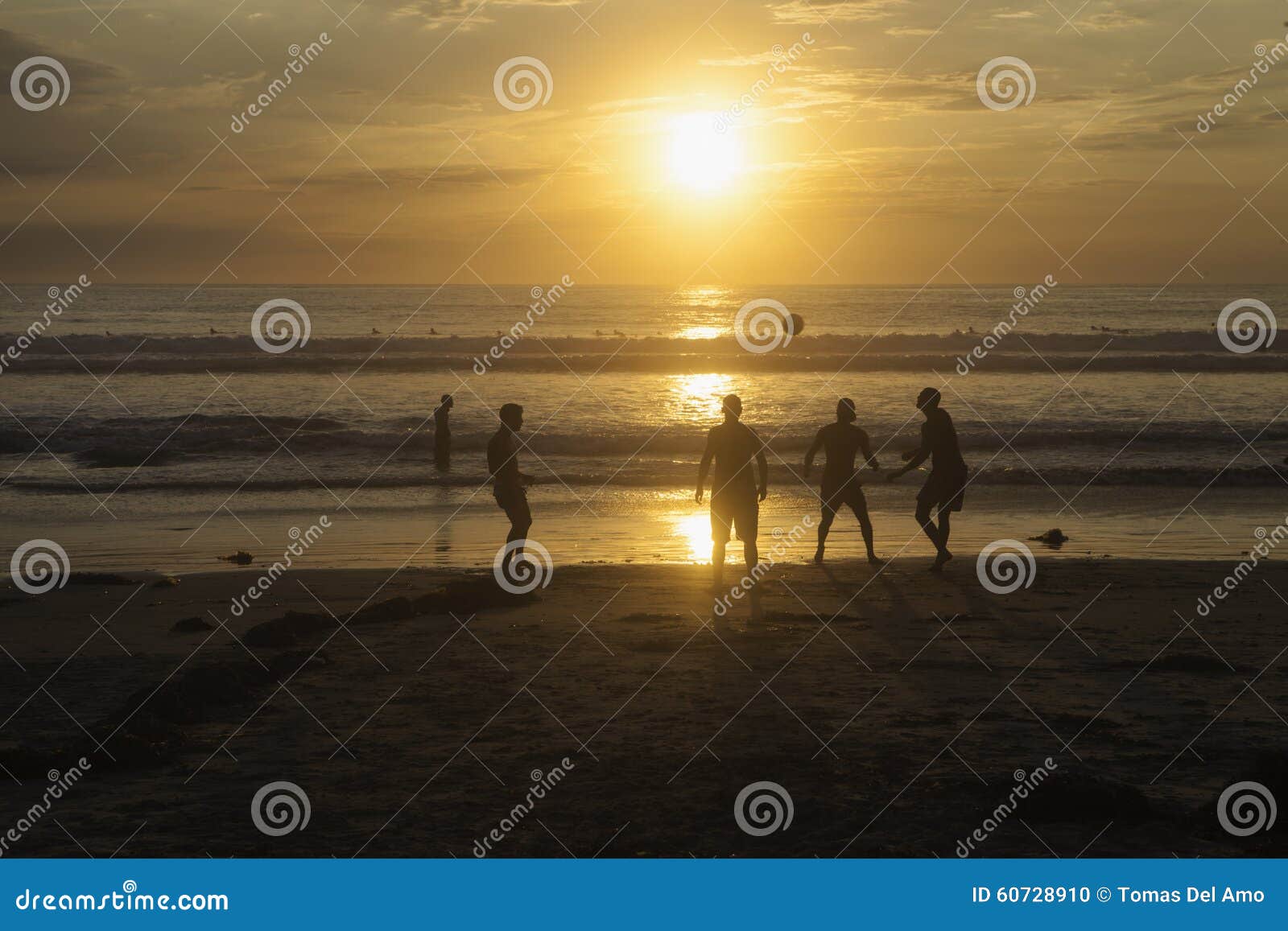 Soccer on the beach stock photo. Image of silhouette - 60728910