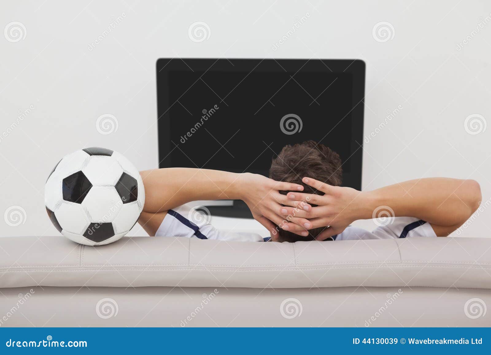 Soccer fan watching tv stock image. Image of person, rear 44130039