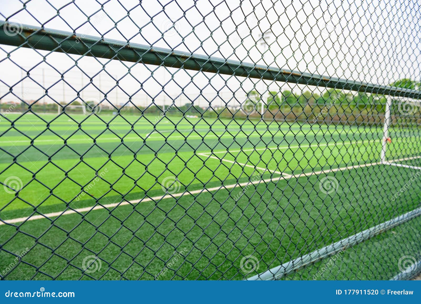 Soccer Field Behind the Fence Stock Photo Image of steel, background