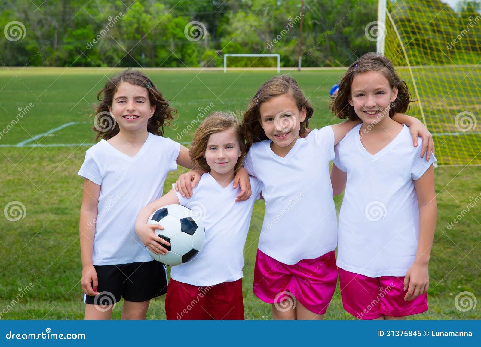 soccer football kid girls team at sports fileld
