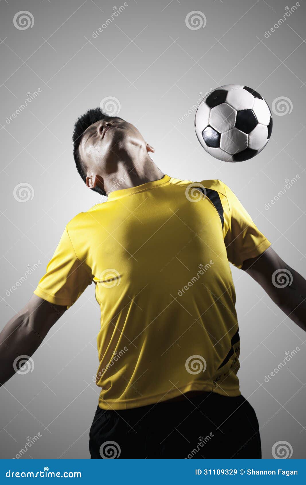Soccer Player Chest Bumping a Ball Stock Image Image of activity