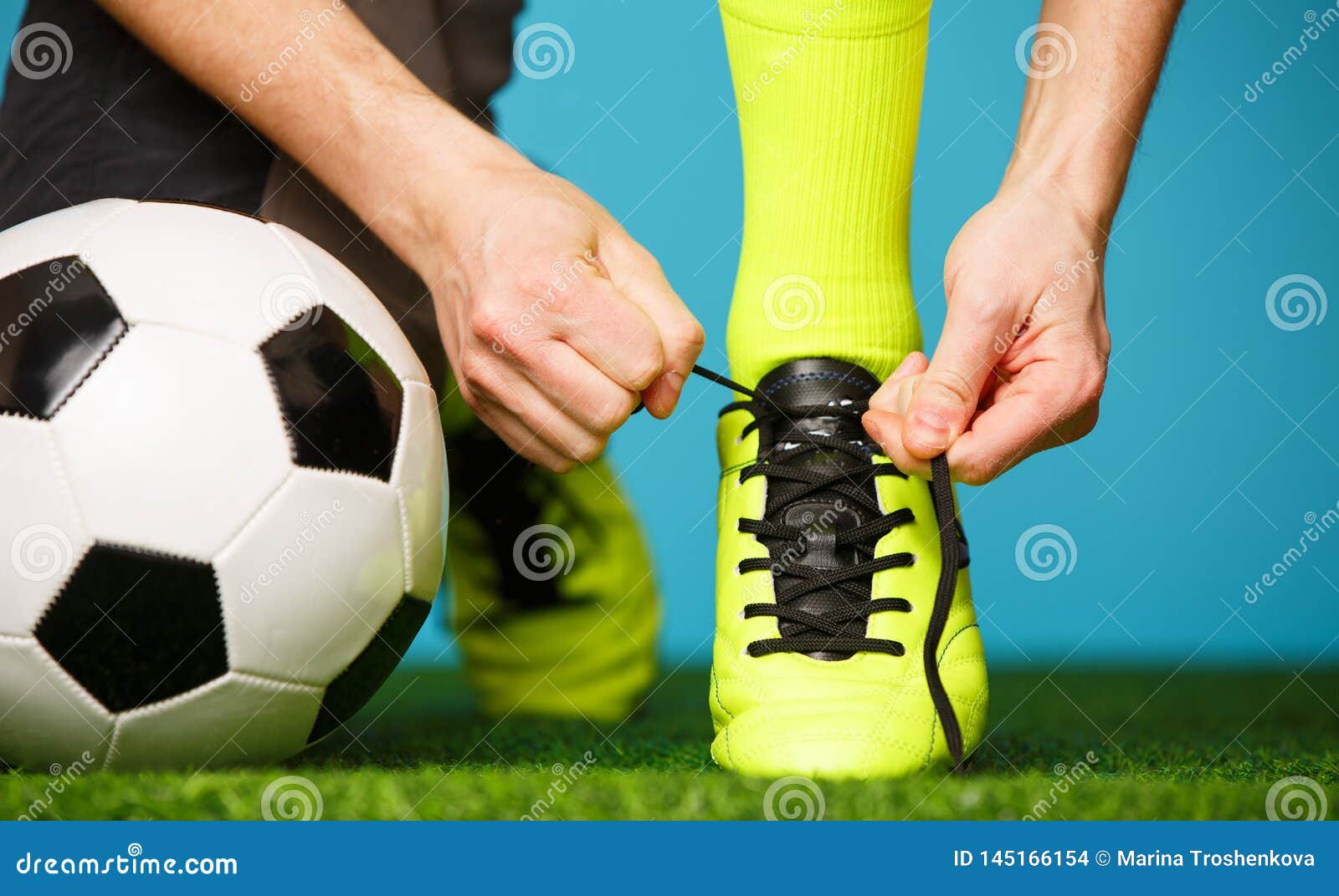 Soccer Player Tying His Shoes Stock Photo Image of break