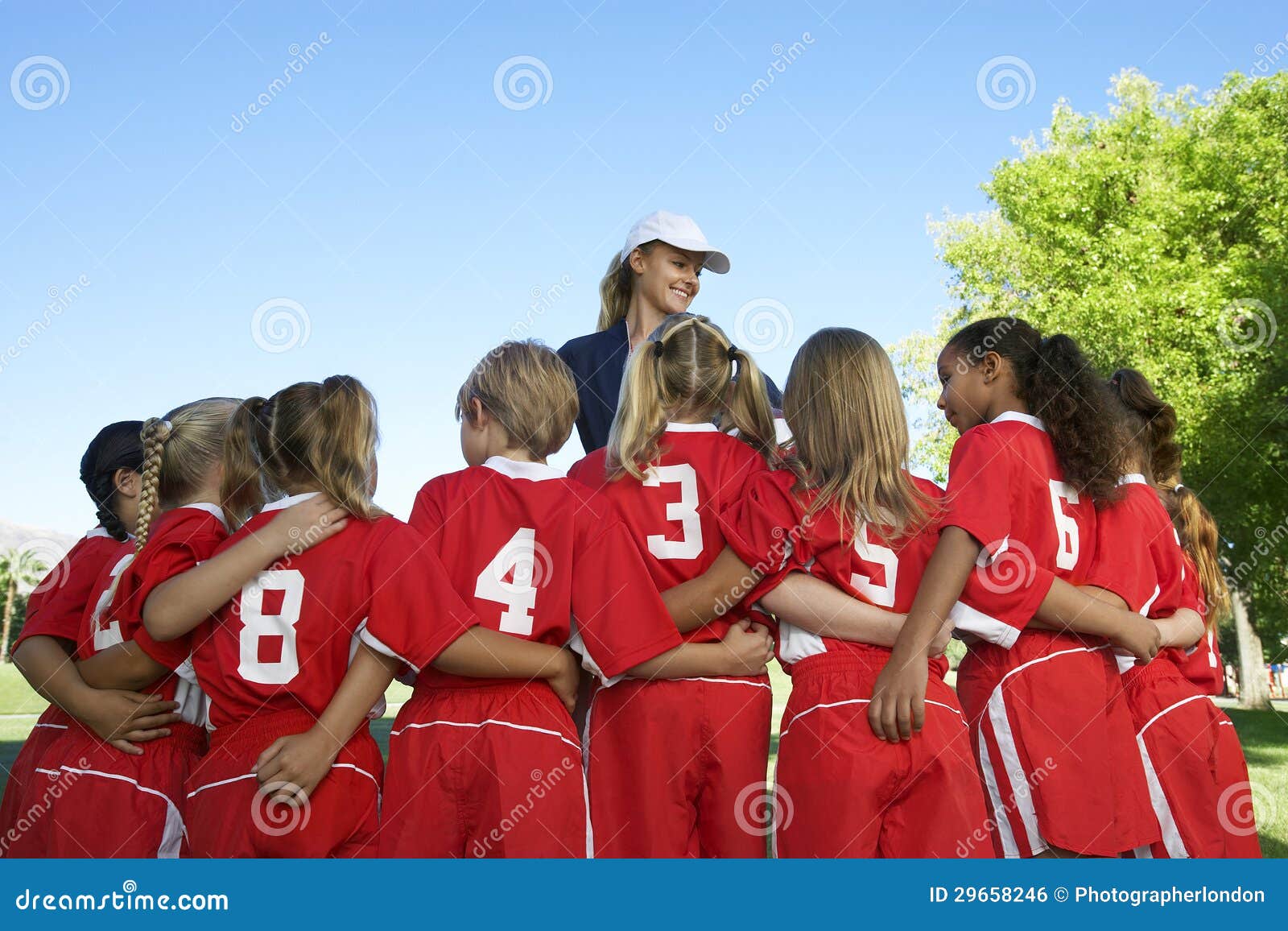 Soccer Players with Coach stock photo. Image of number 29658246