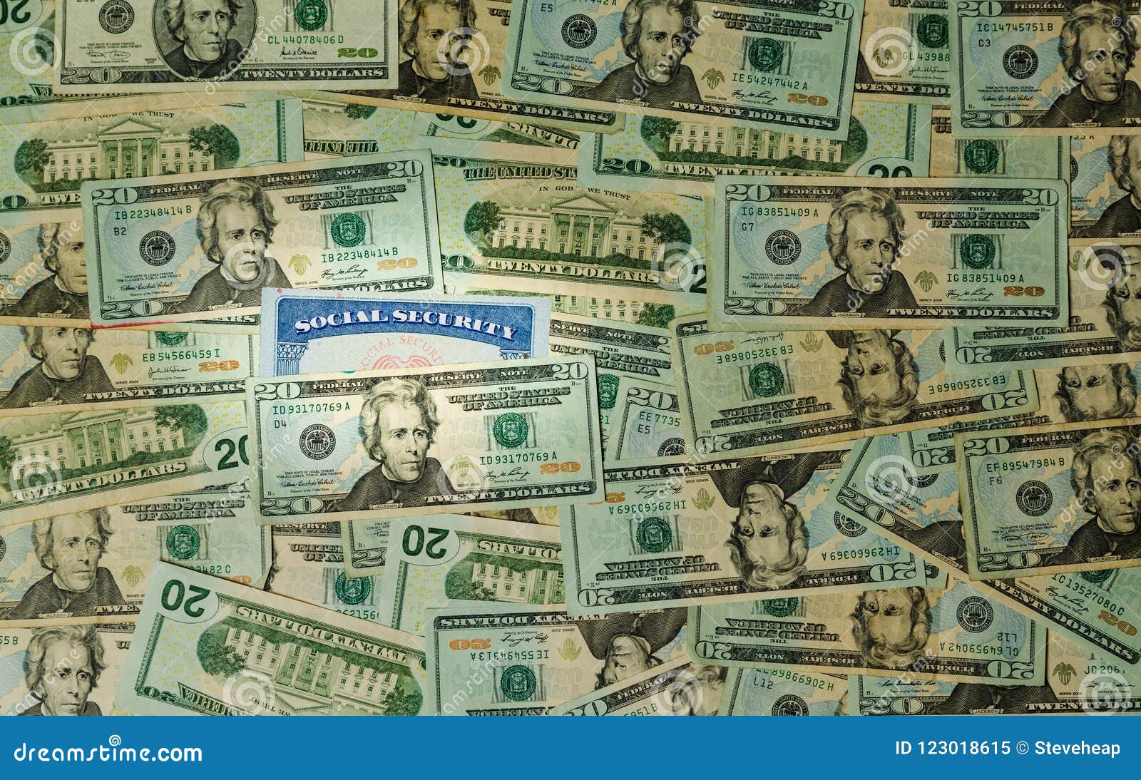 Social Security Card among Thousands of US Dollar Bills Stock Image