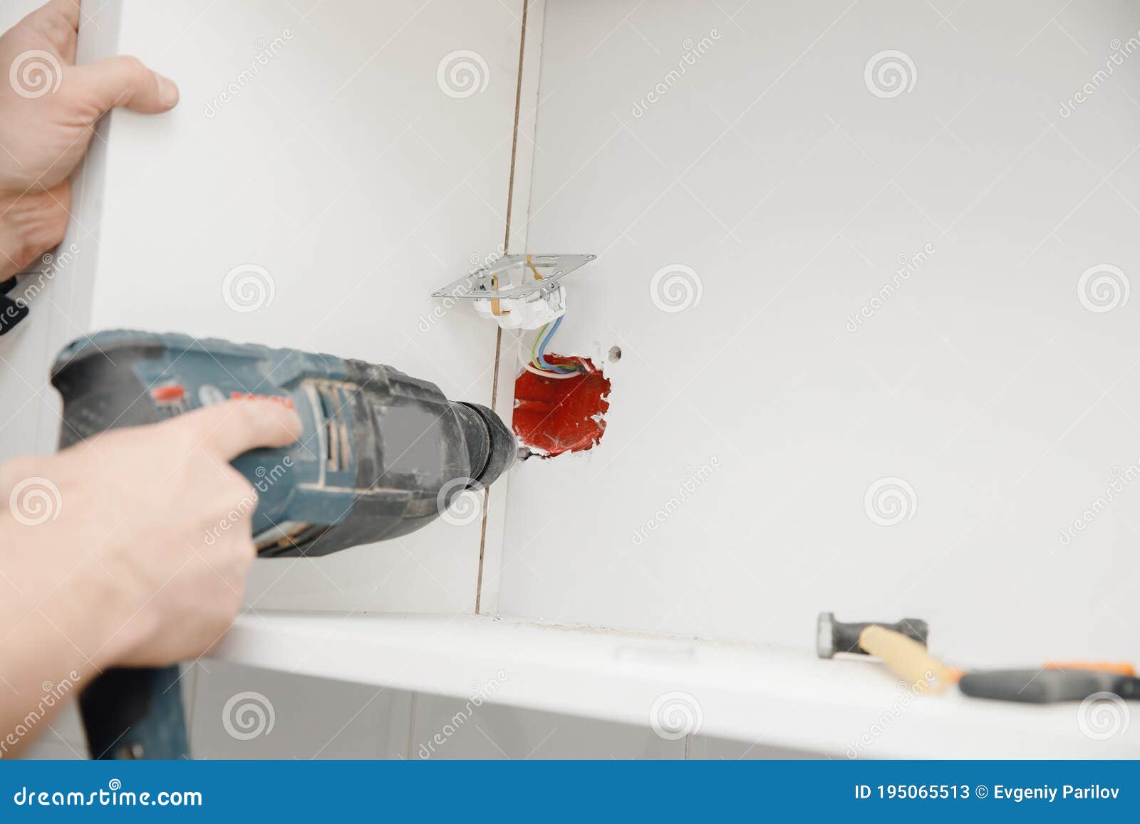 Sockets Outlet Install Electrician Man Builder Working at Home Stock