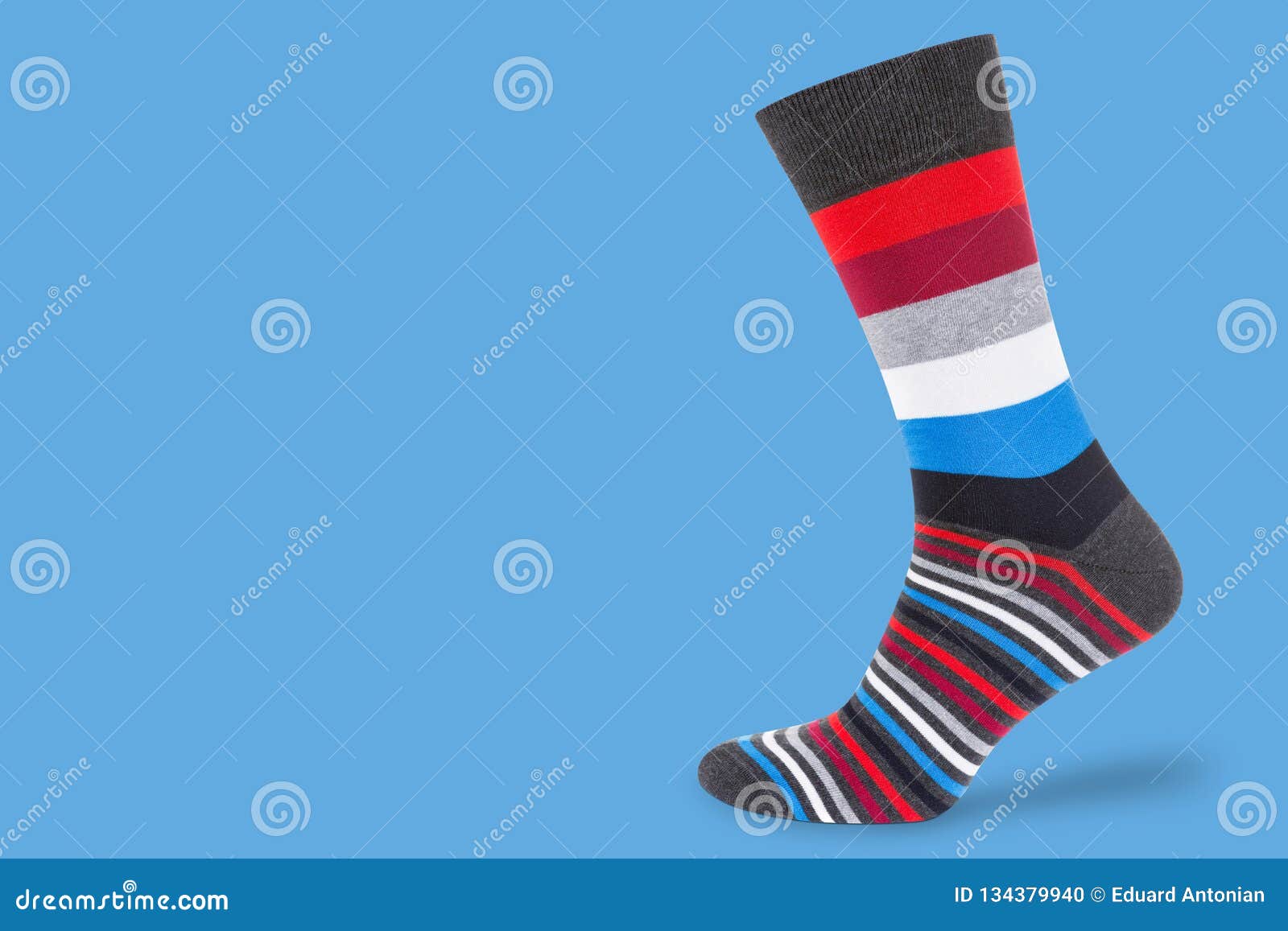 Socks with Multicolor Stripes on a Pastel Blue Background, Concept ...