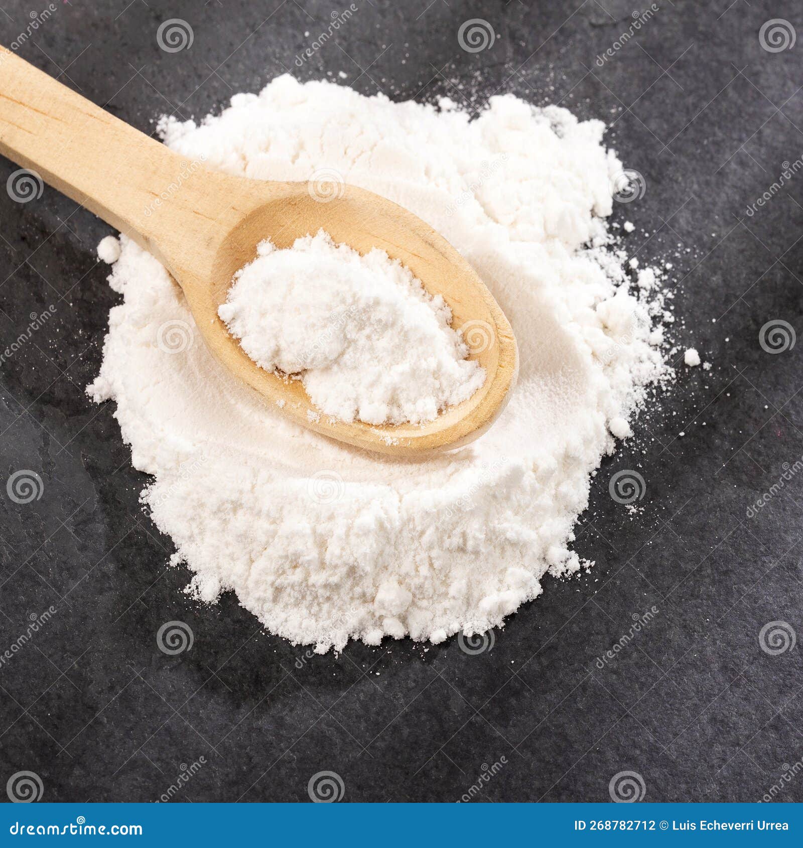 Sodium Hydrogen Carbonate White Baking Soda in Wooden Spoon Stock