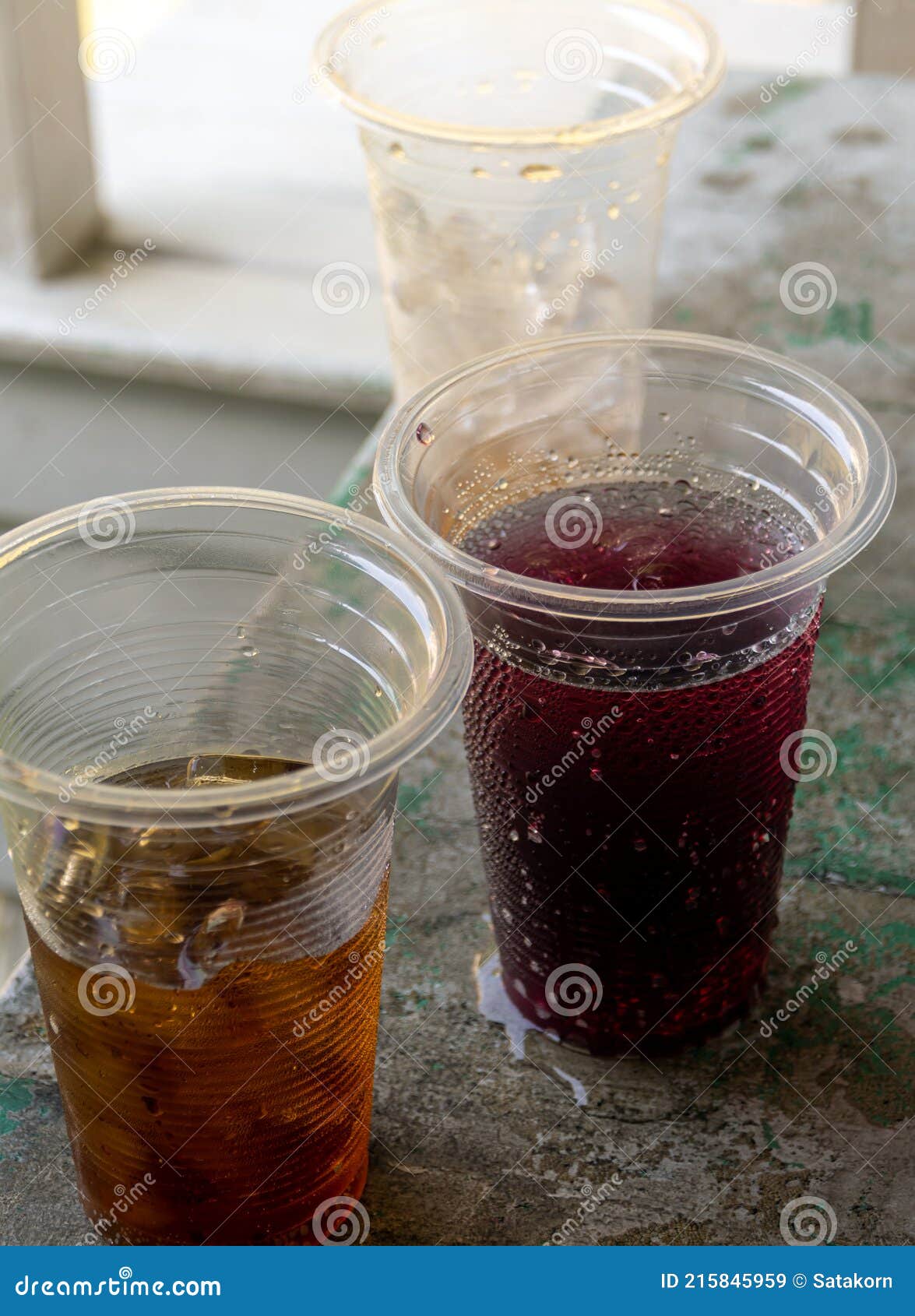 Soft Drink and Ice in the Disposable Plastic Glasses Stock Image