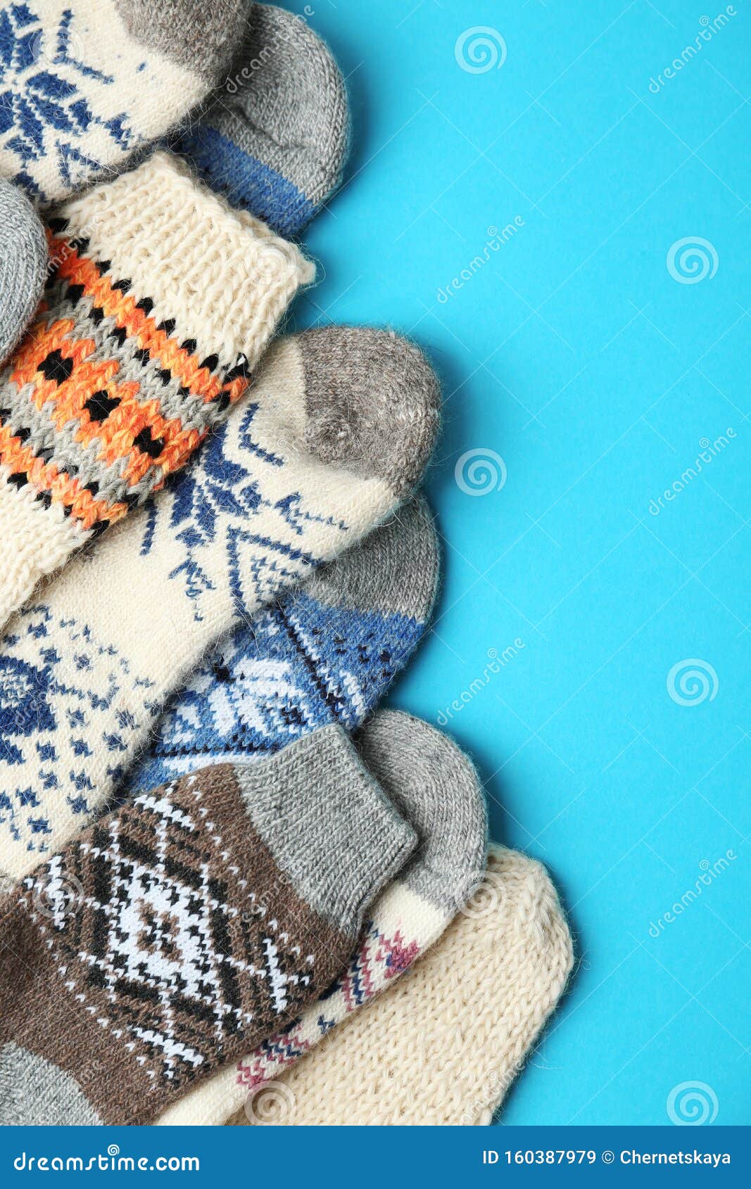 Soft Knitted Socks on Light Blue Background. Winter Clothes Stock Image ...