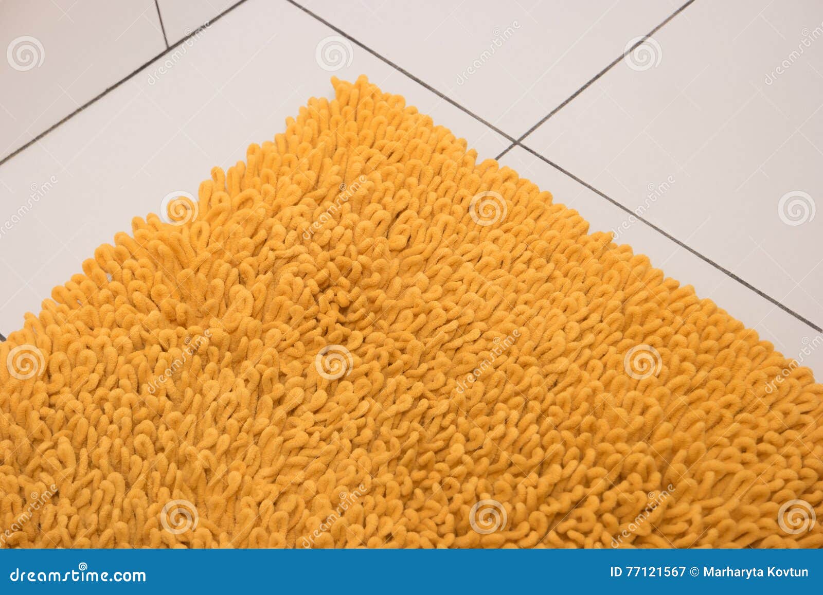 Soft Yellow Carpet Lies on a White Tile. Stock Image Image of