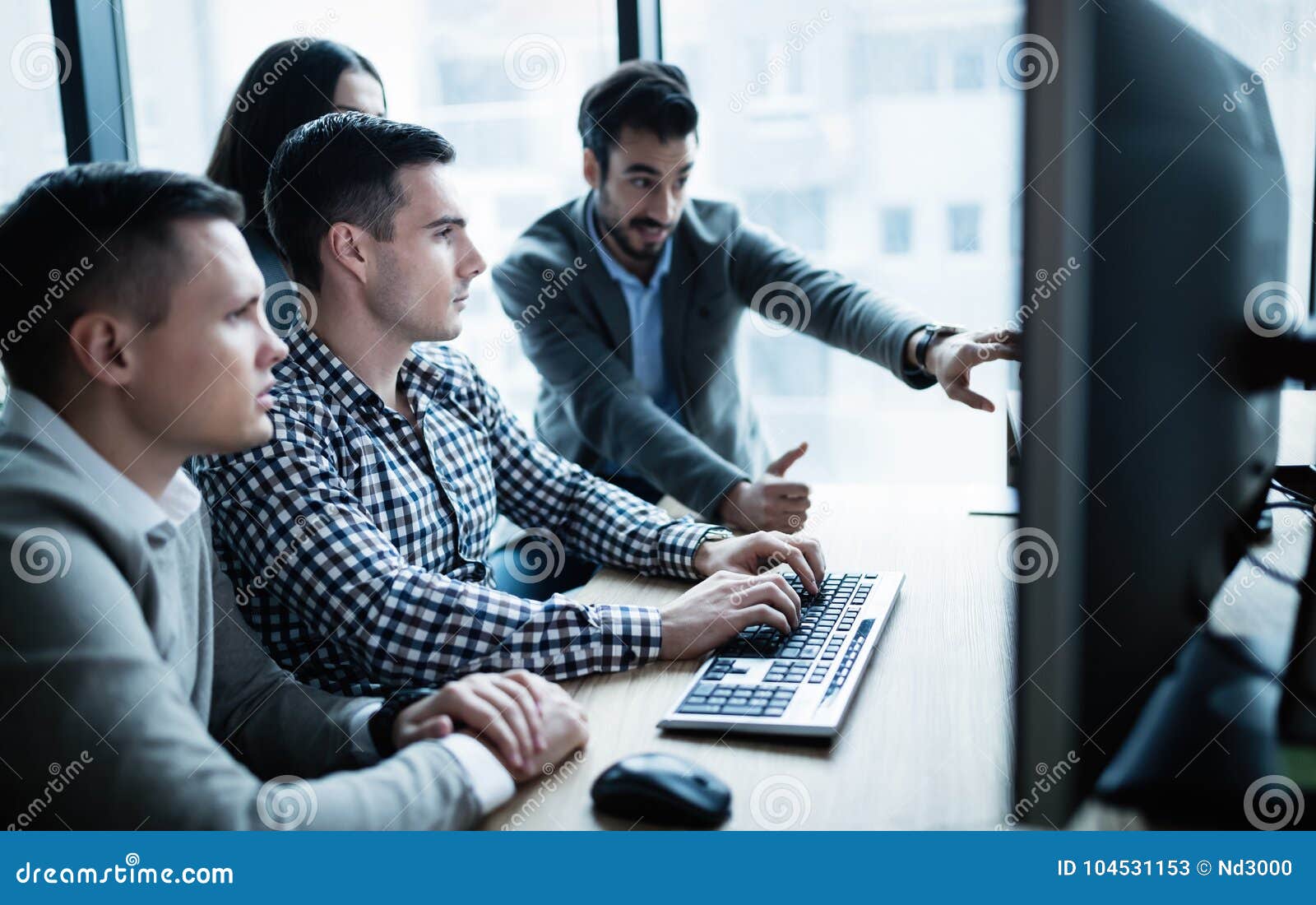 software engineers working in office on project together