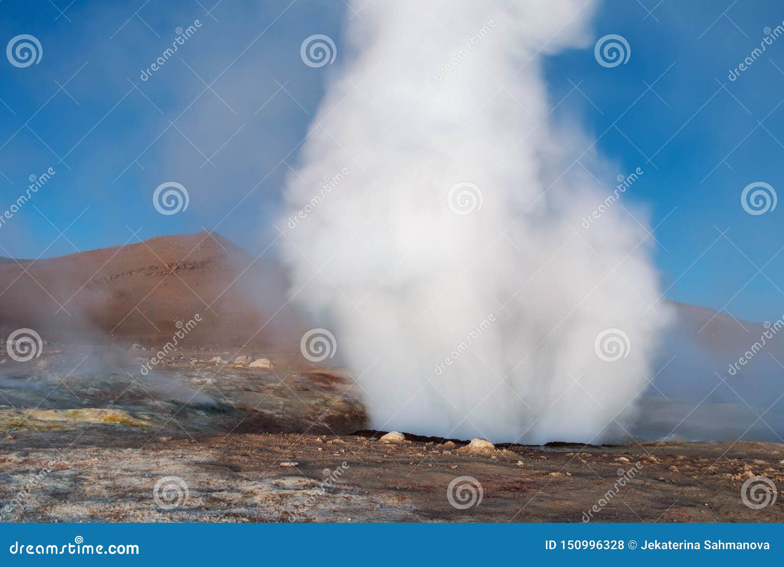 the sol de la manana, rising sun steaming geyser field high up in a massive crater in bolivian altiplano, bolivia