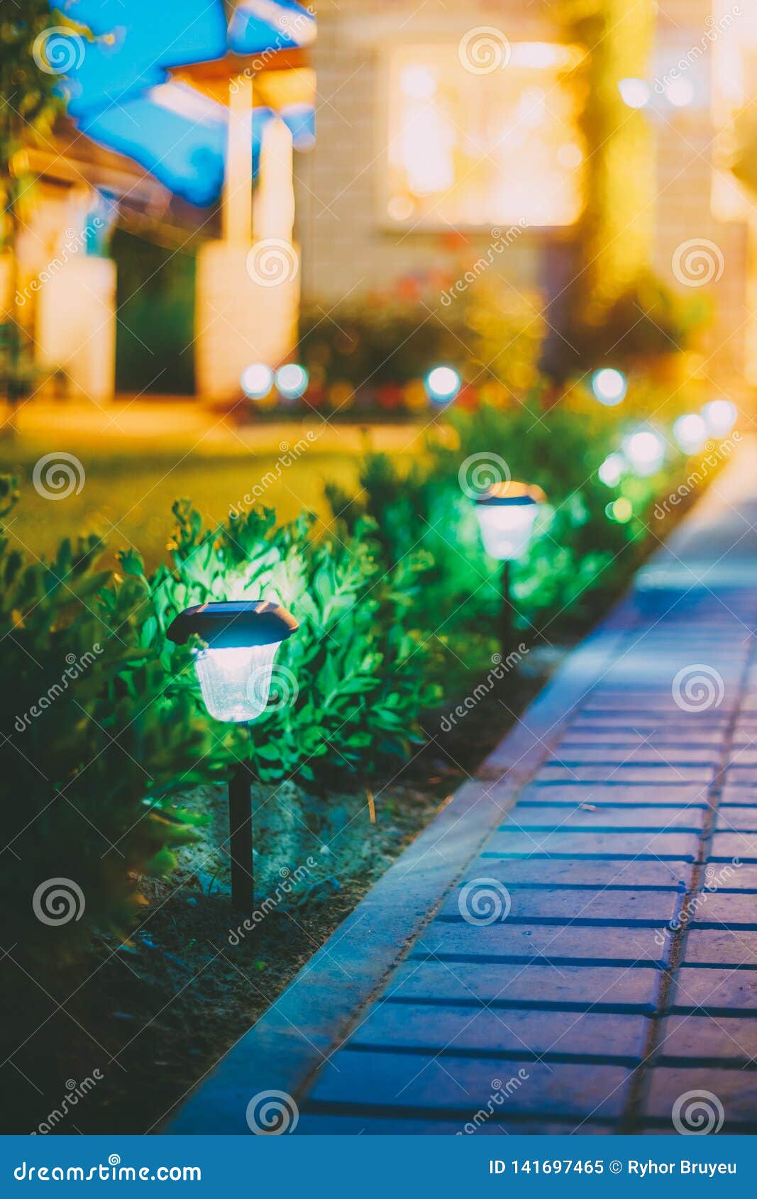 Solar Garden Light, Lanterns in Flower Bed. Garden Design Stock Image