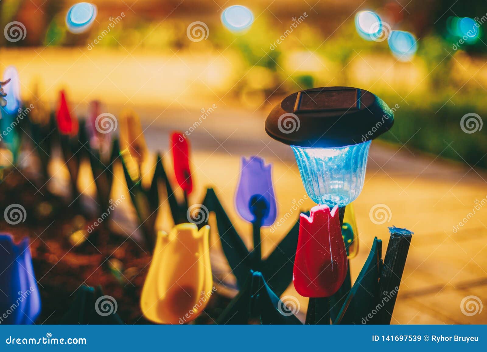 Solar Garden Light, Lanterns in Flower Bed. Garden Design Stock Image