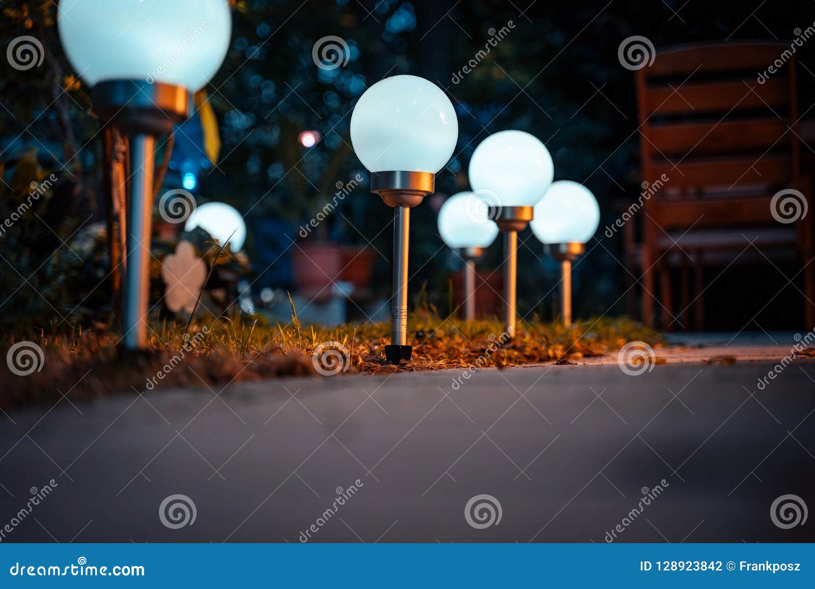 Solar lamps in the garden stock photo. Image of lantern 128923842