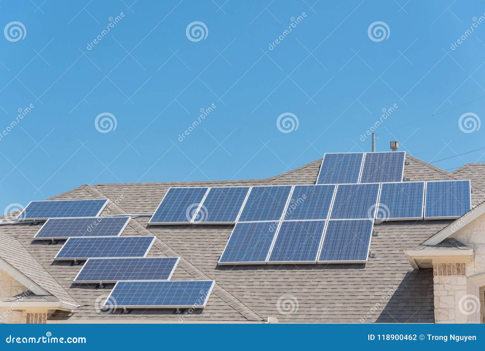Solar Panel Installation on Asphalt Shingles Rooftop Stock Photo