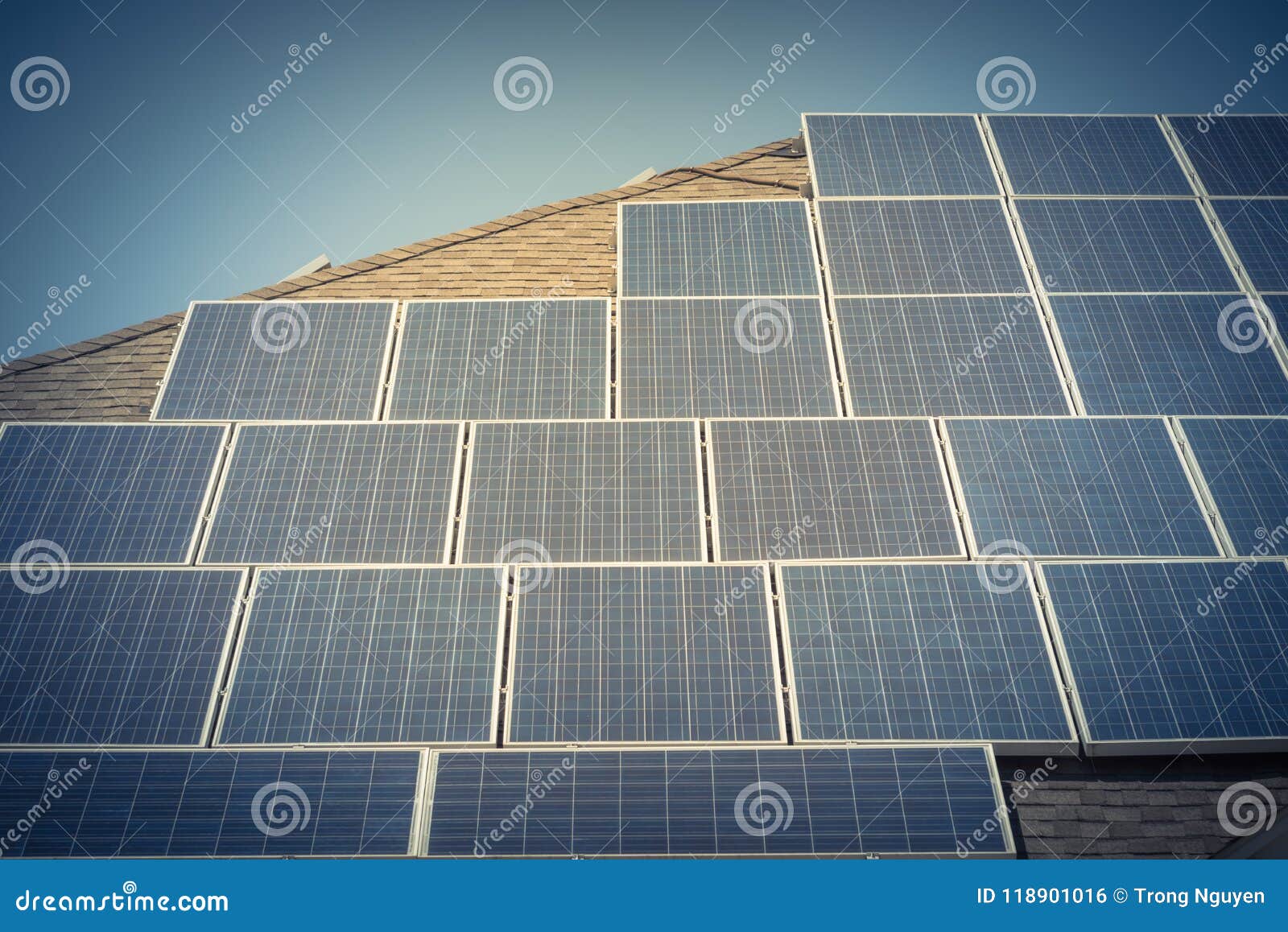 Solar Panel Installation on Asphalt Shingles Rooftop Stock Photo