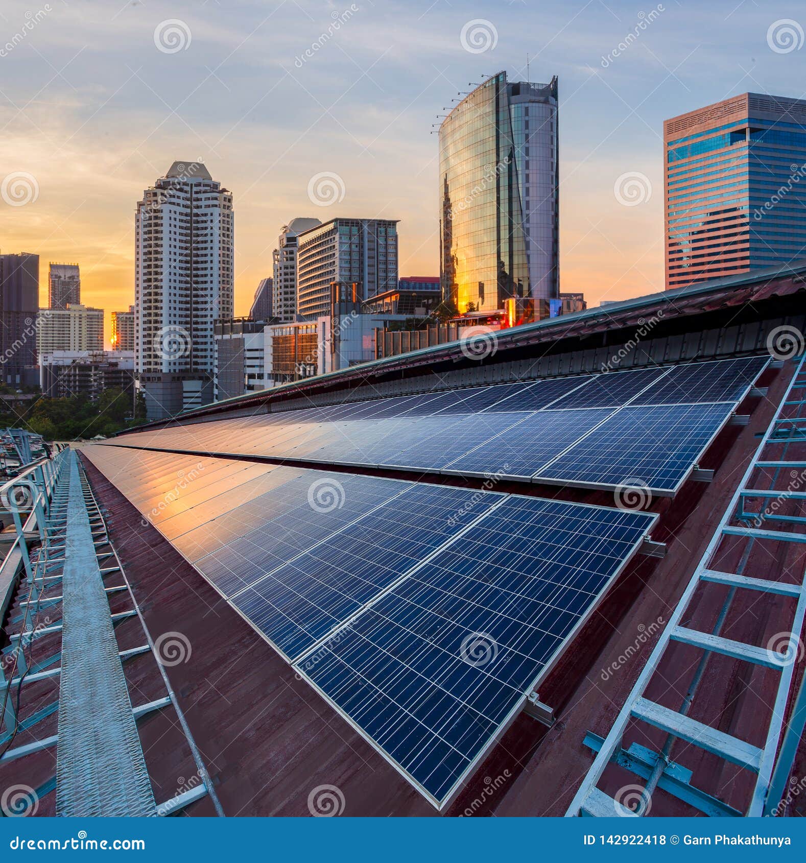 solar panel photovoltaic installation on a roof of factory, sunny blue sky background, alternative electricity source -