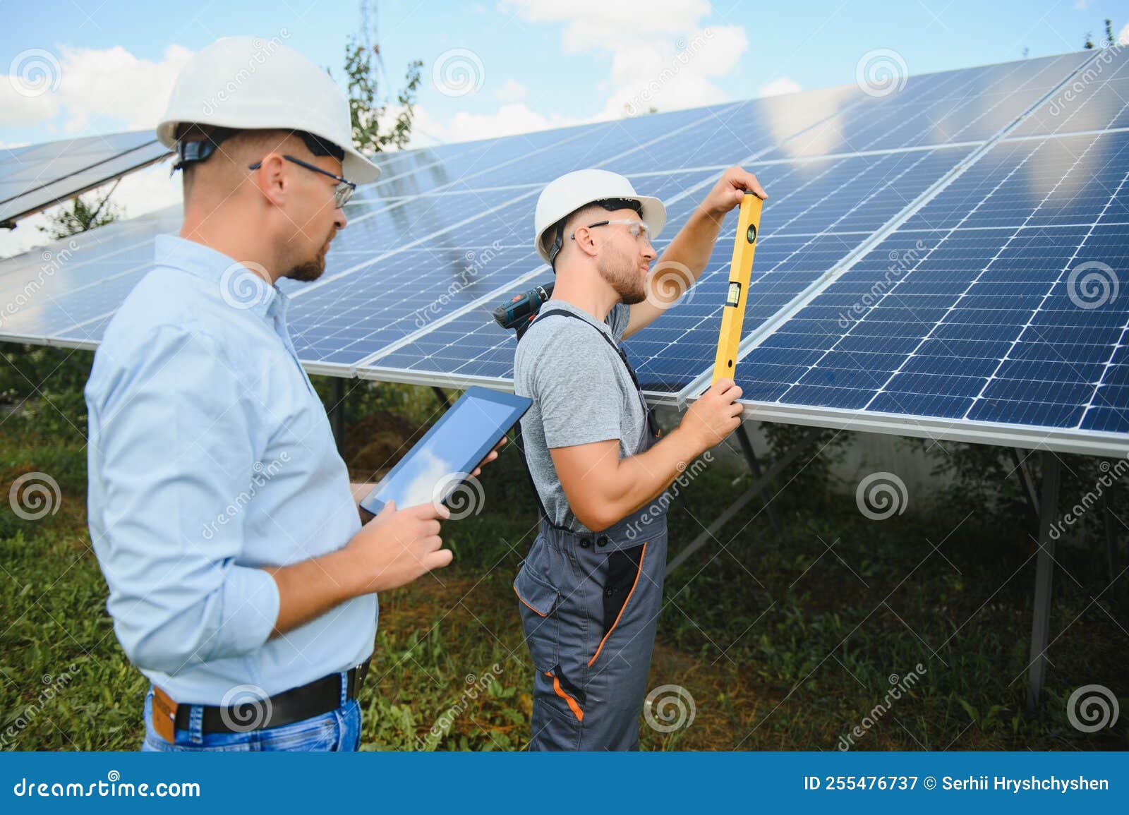 Solar Panel. Technician Installing Solar Panels on a Sunny Day Stock