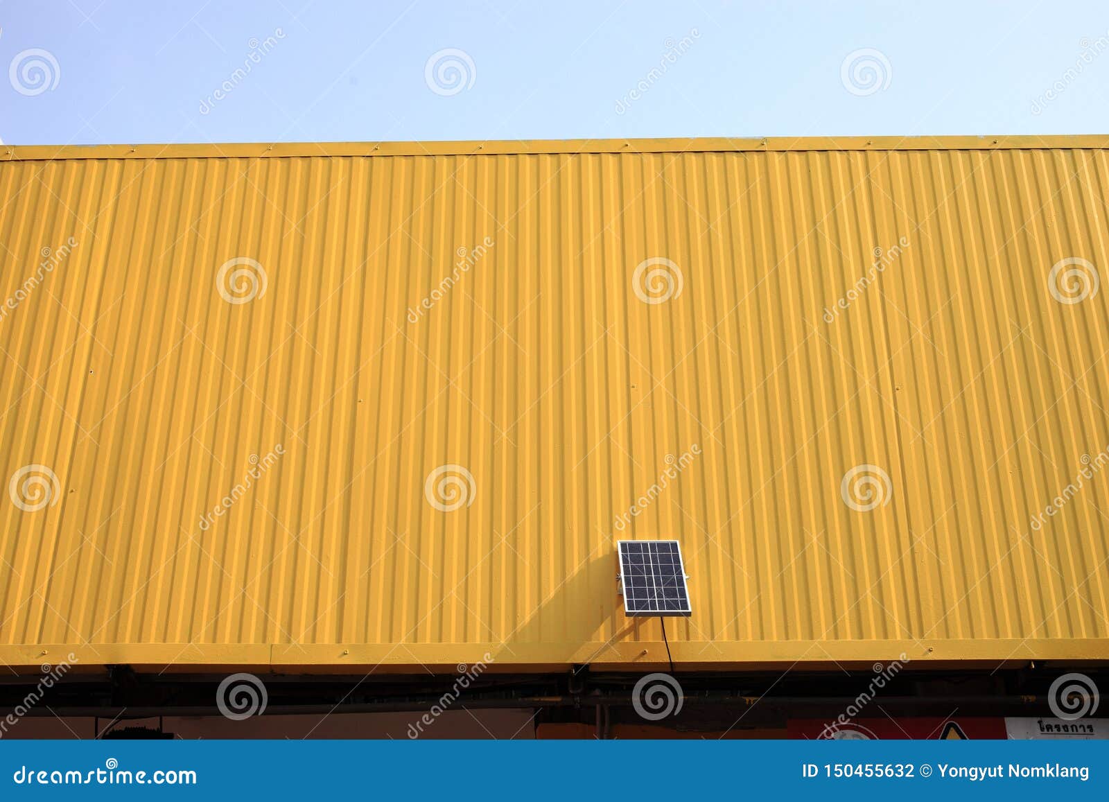 Solar panel on yellow metal sheet roof. Solar panels to save energy on the roof, yellow metal sheet