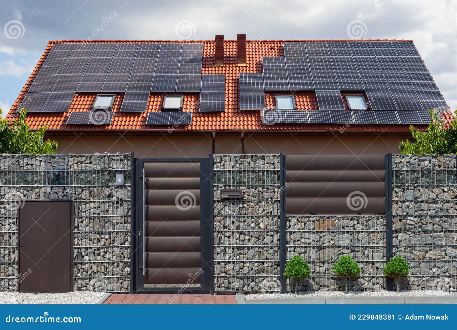 beautiful modern house with solar panels. clear sky, sun