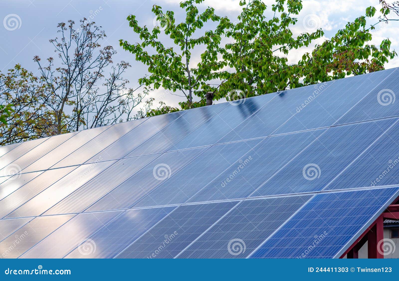 Solar Panels on the Roof of the Building. Solar Energy. Alternative Source of Electricity Stock