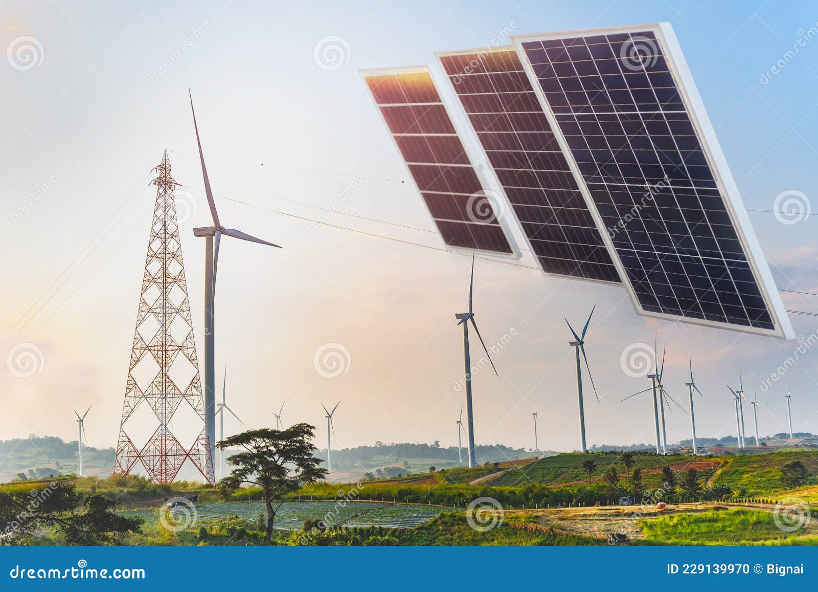 solar panels with wind turbines against mountanis landscape power and energy.