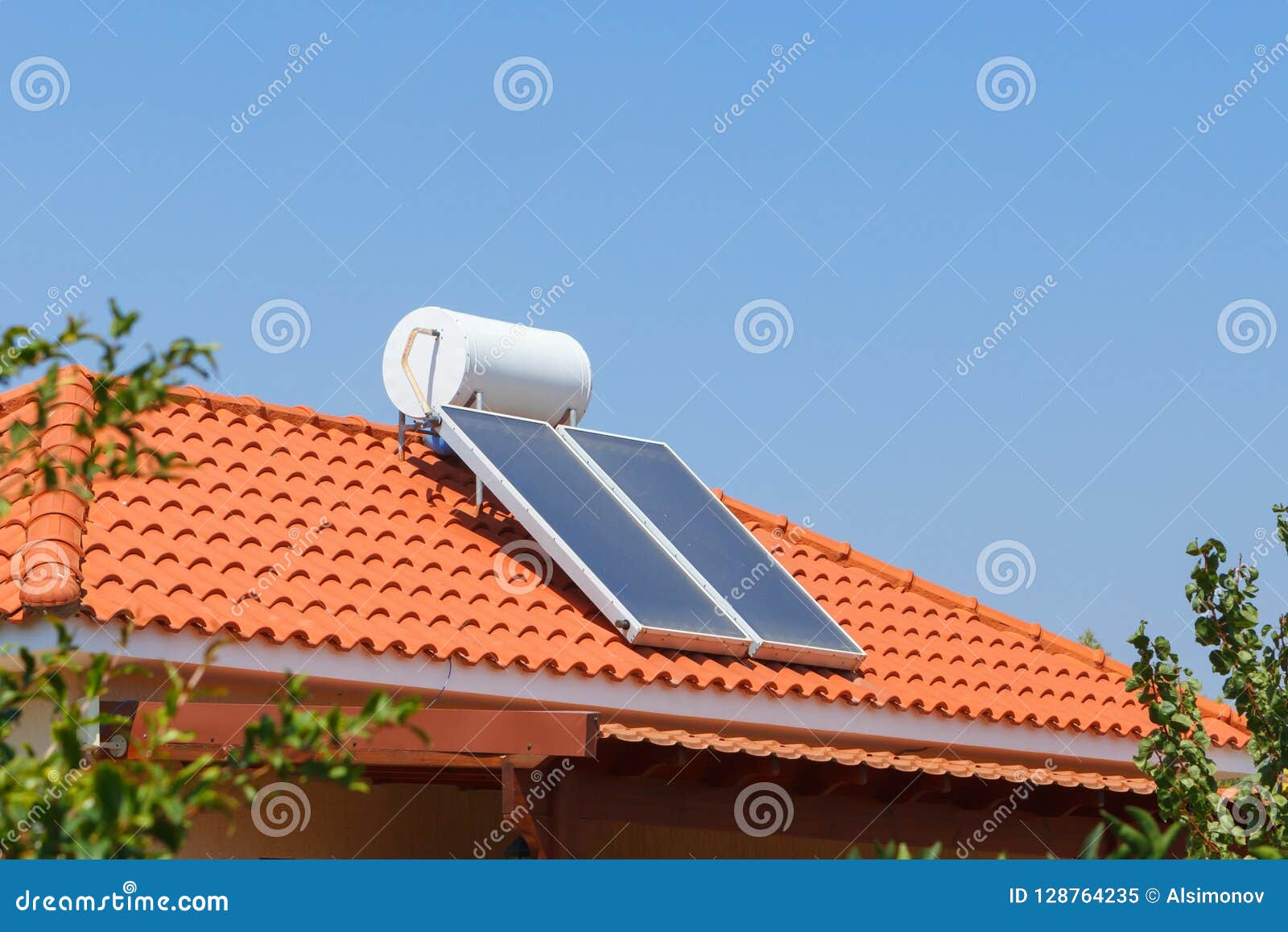 Solar Water Heating Panel and Water Collector on a House Roof. Stock