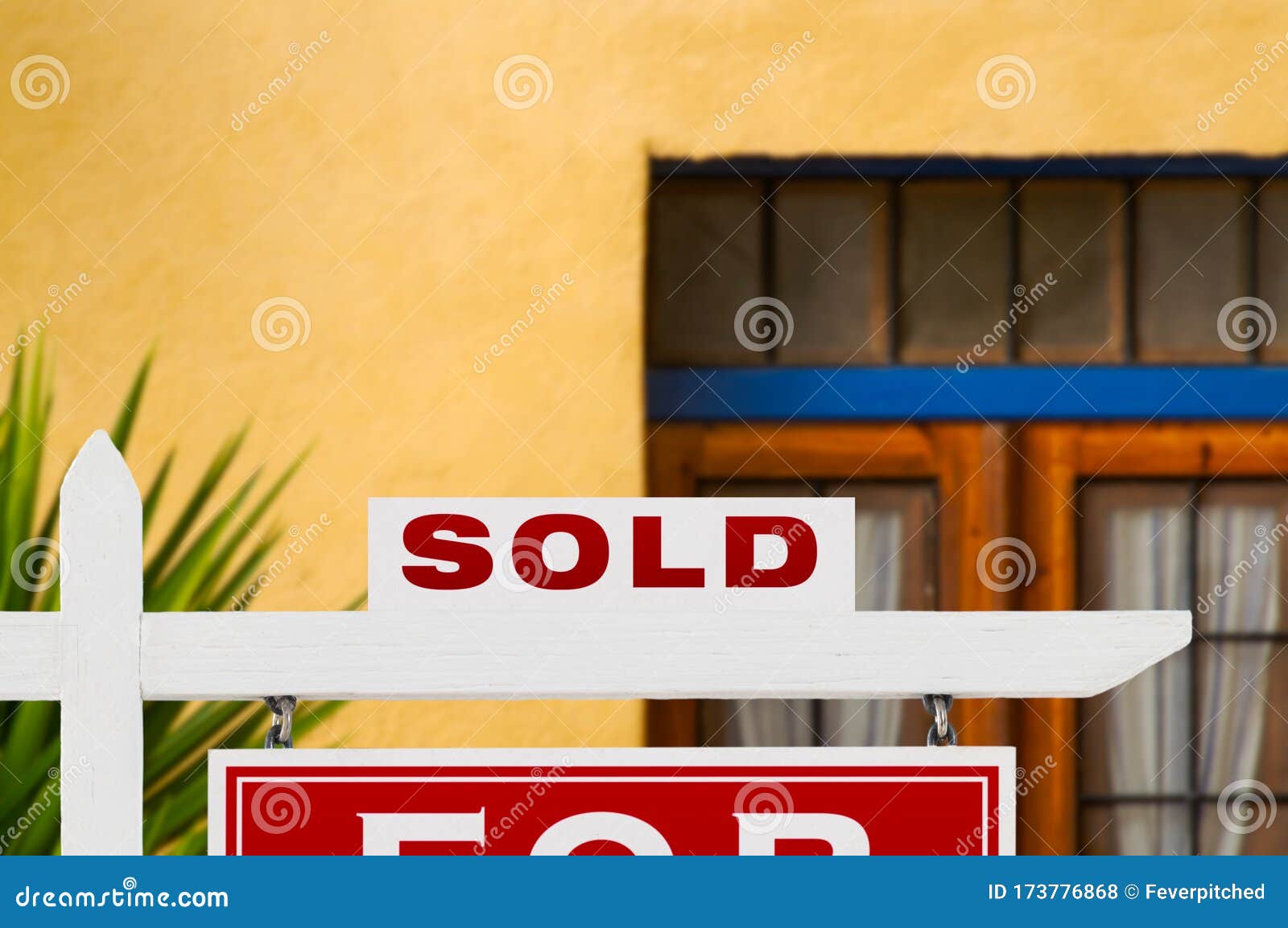sold home for sale real estate sign and house