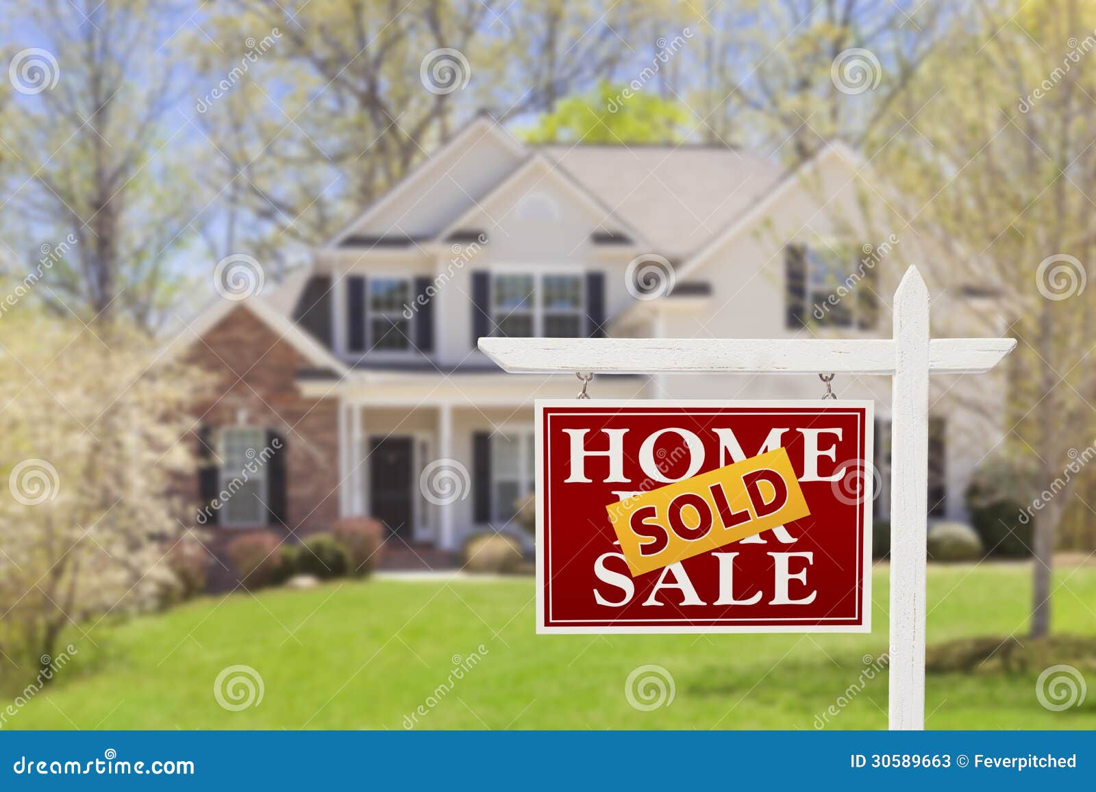 sold home for sale real estate sign and house