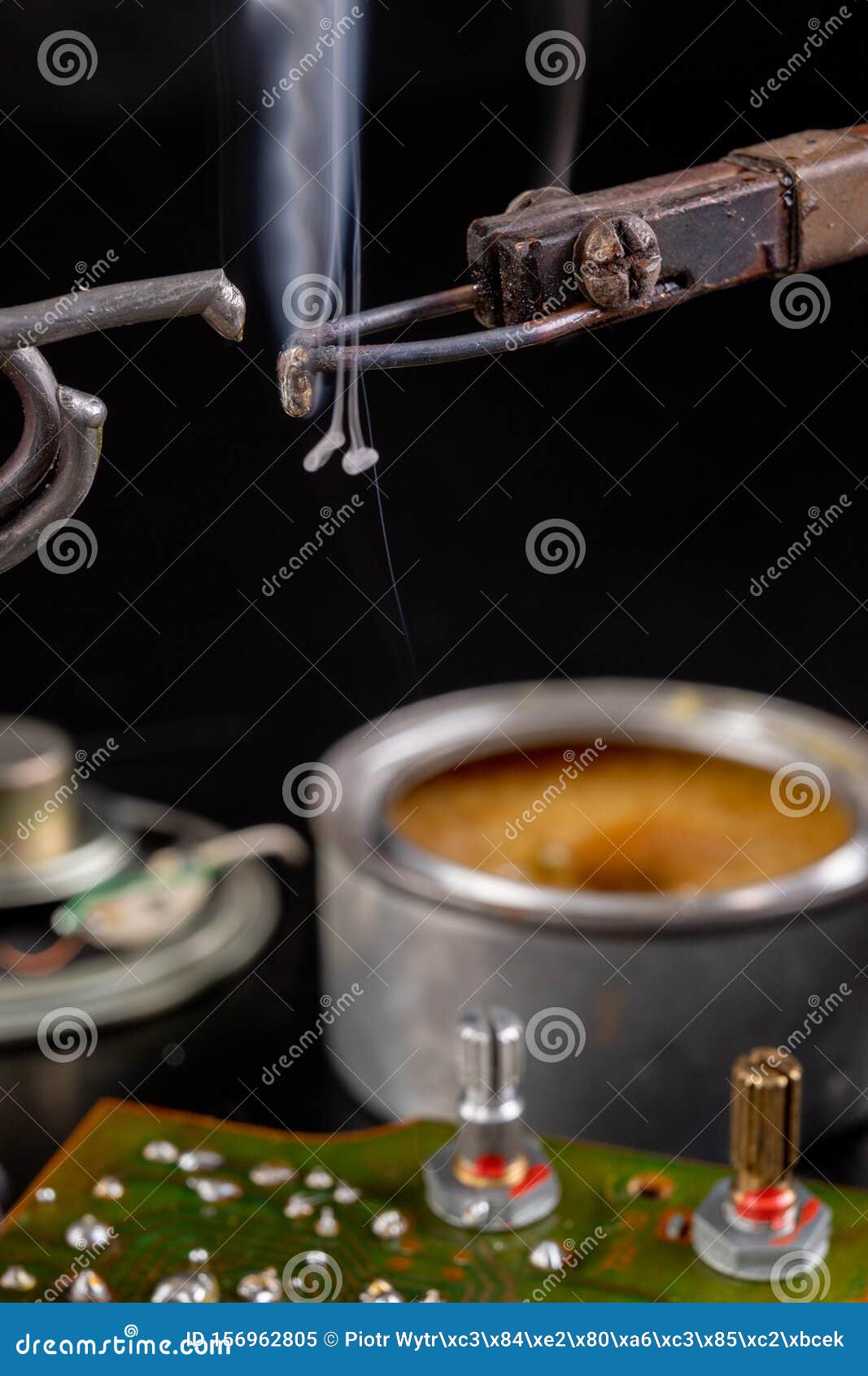 soldering of an integrated circuit in an electronics workshop. small electronic works