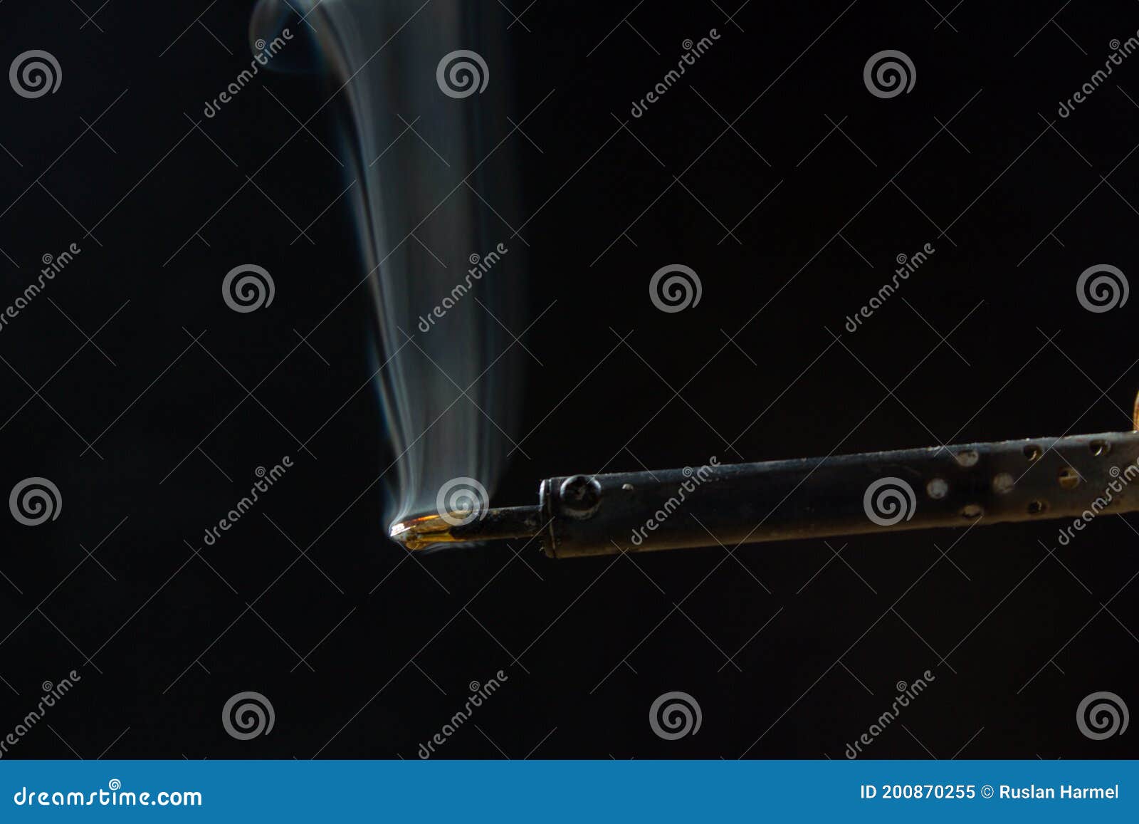 Soldering Iron with Smoke from the Sting of Burning Rosin. Photo on a ...