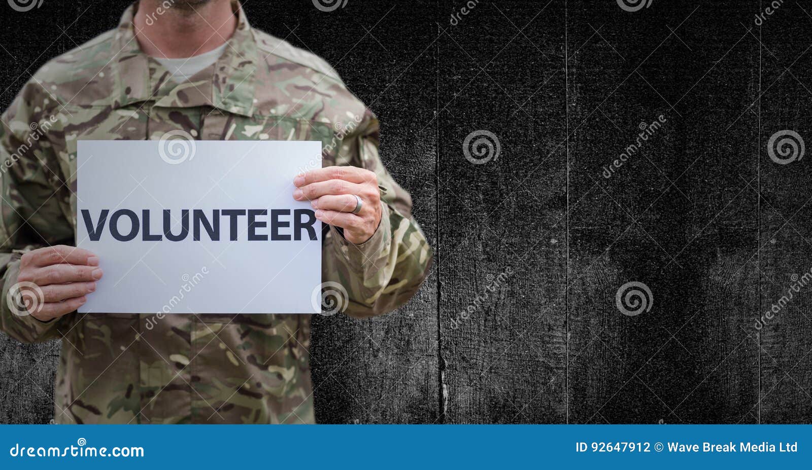 Soldier Volunteer Mid Section Against Black Wood Panel Stock