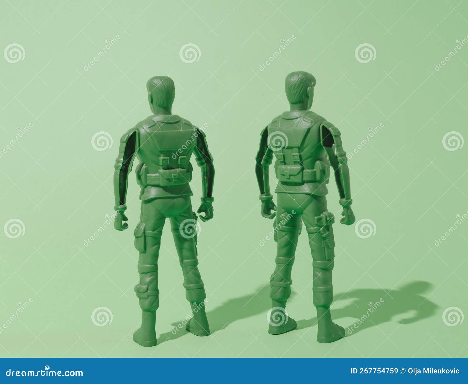 soldiers on guard, watching with their backs turned. green background. wartime in the twenty-first century