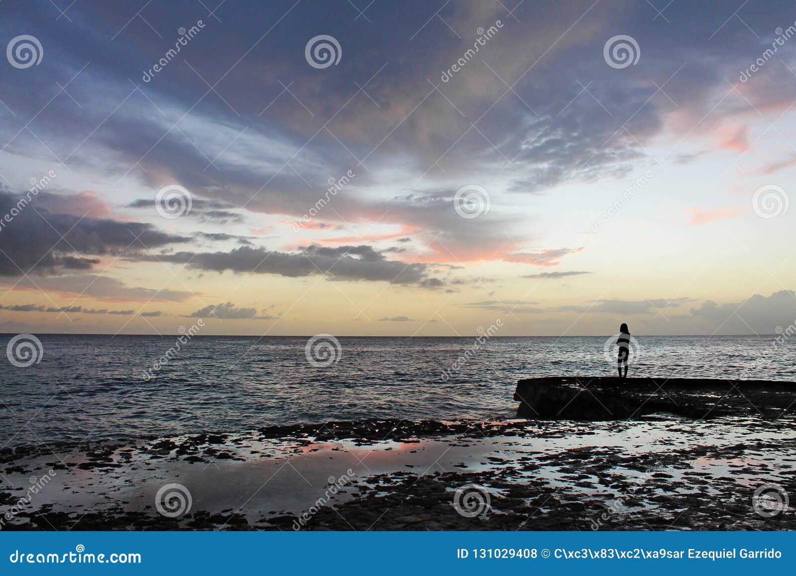 solemn silhouette facing the caribbean sea