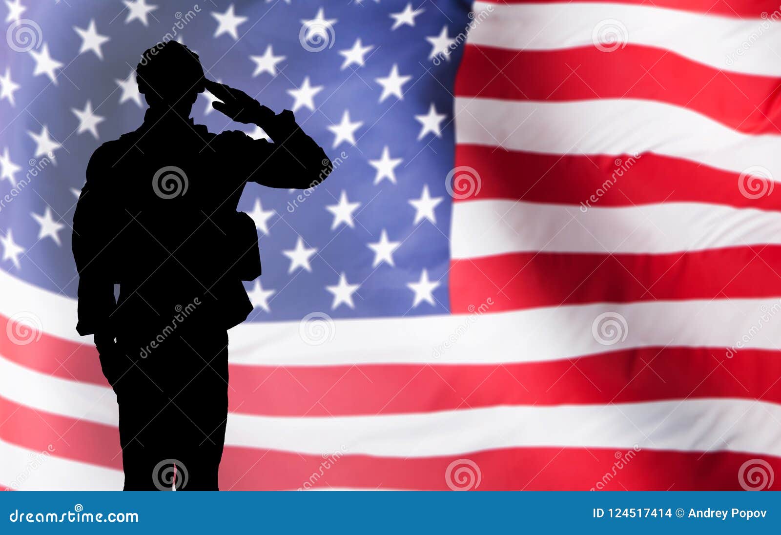 solider saluting against the american flag