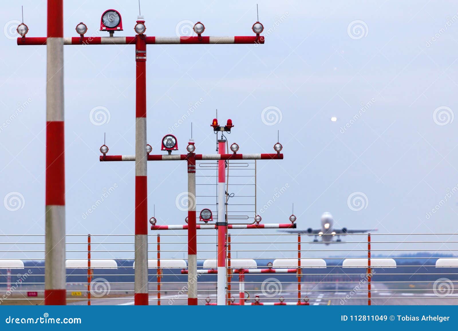 Airport Beacons with Starting Airplane in the Daylight Stock Image ...
