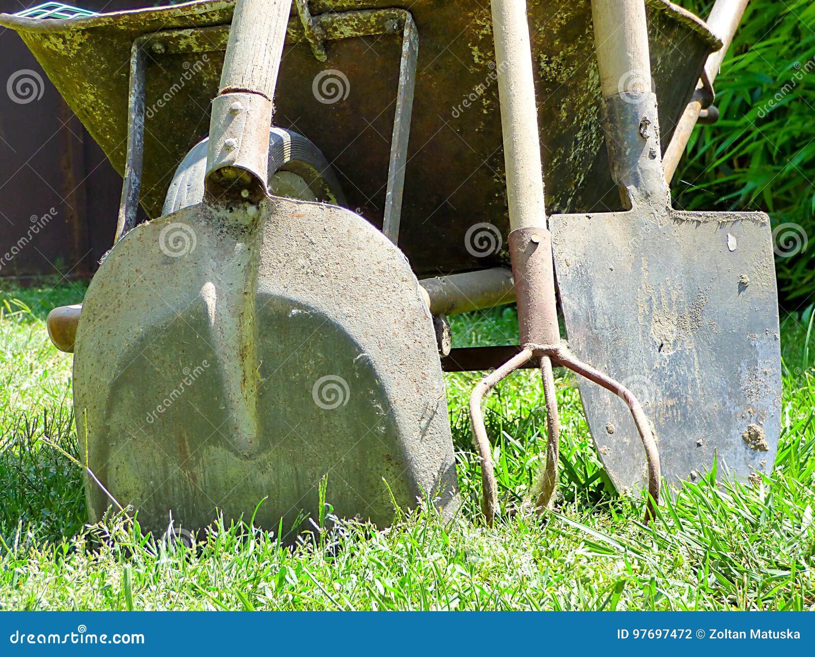 Some Garden Tools Near an Old Wheelbarrow Stock Photo Image of wooden