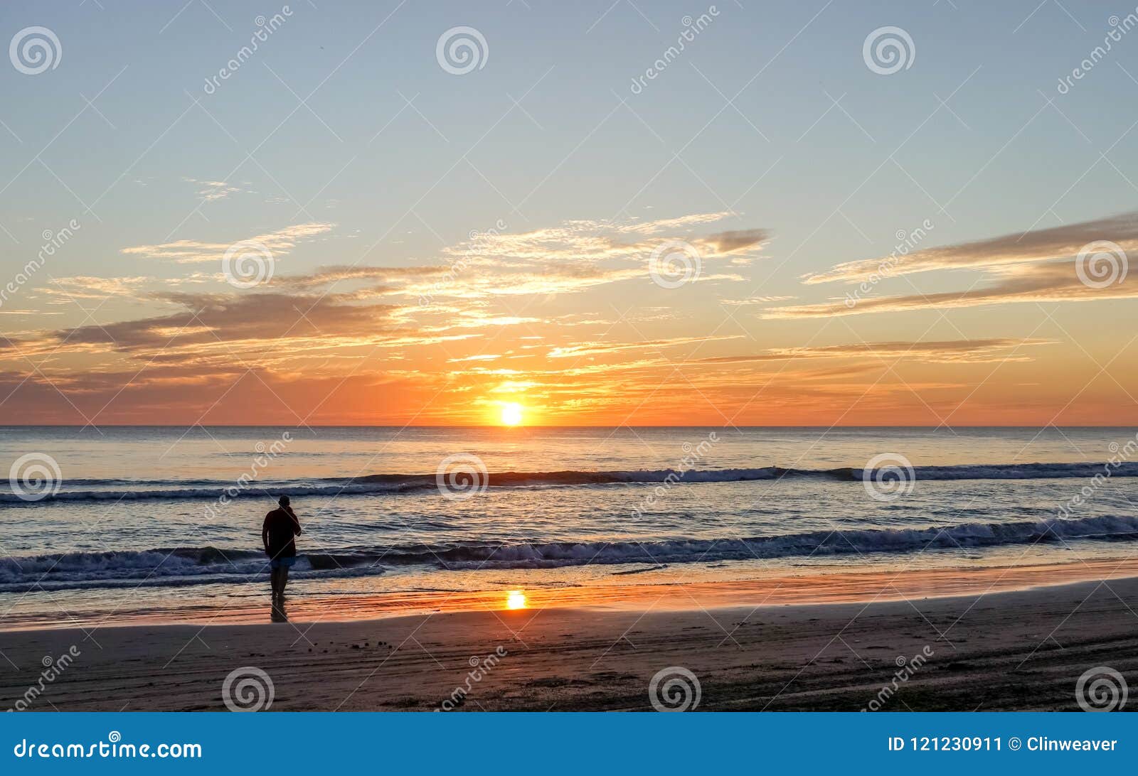 Silhouette of Man at Beach stock image. Image of clouds - 121230911