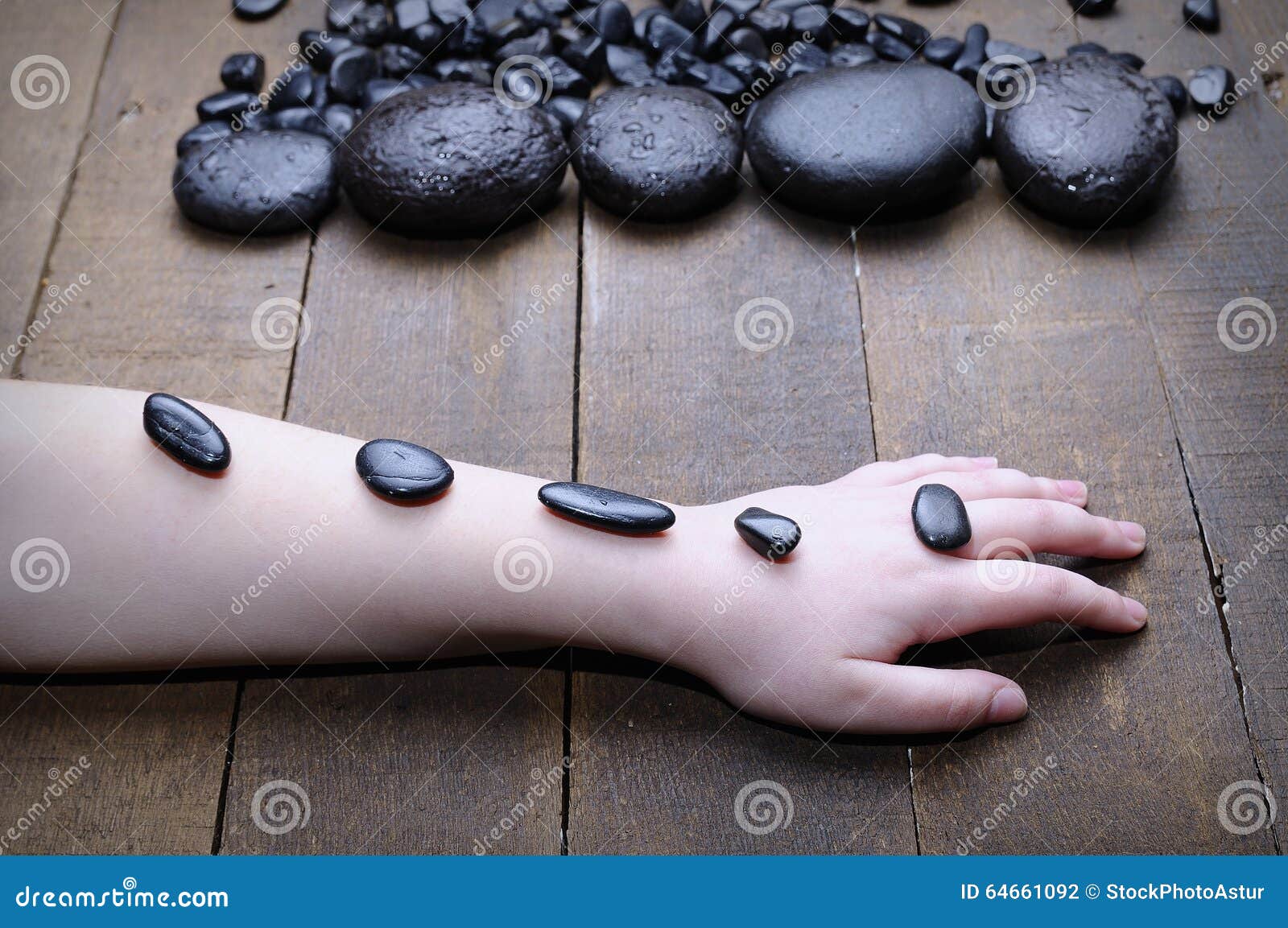 Someone S Hand Covered with Spa Stones Stock Photo Image of body, care 64661092