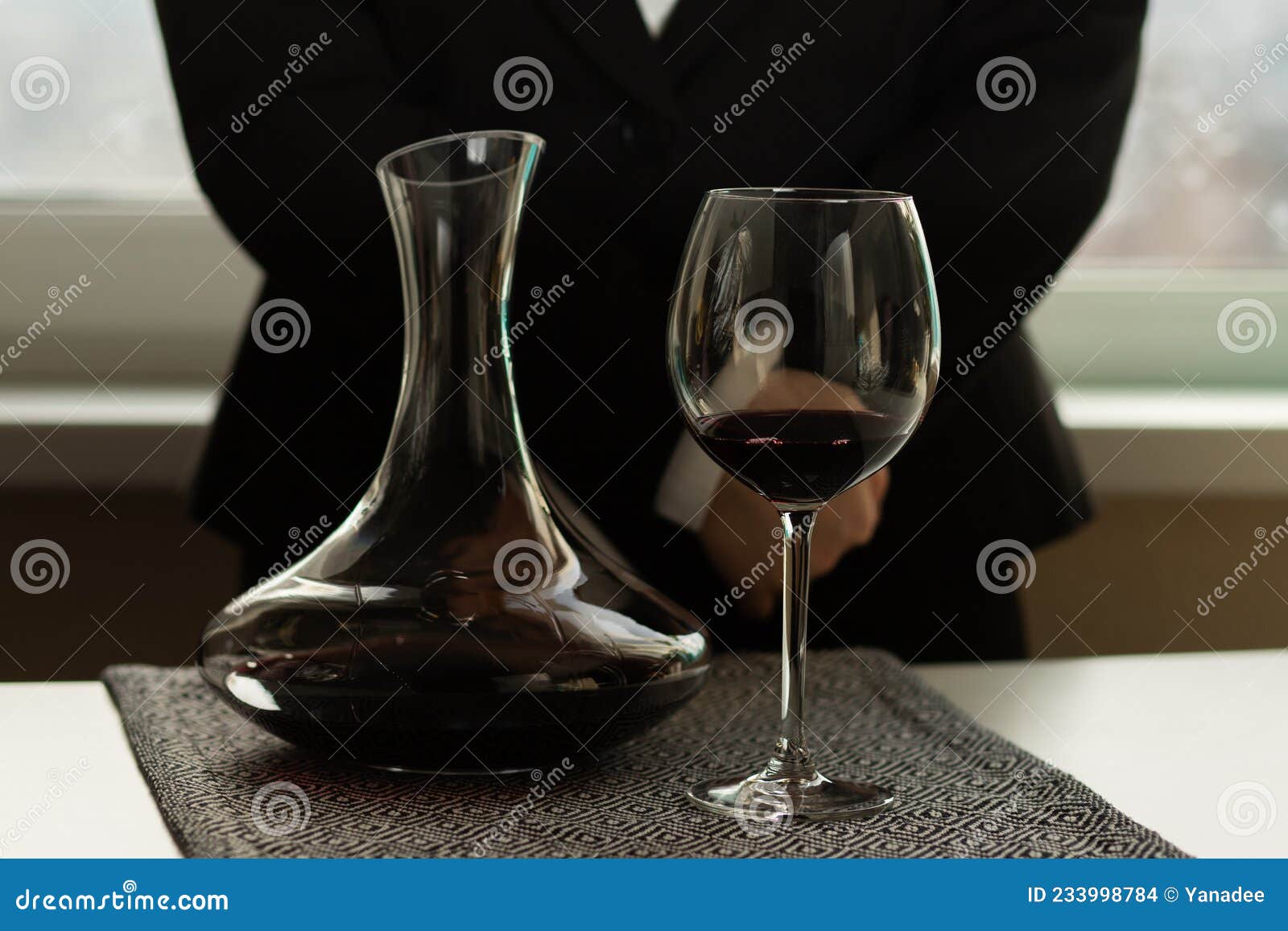 Sommelier with a Bottle of Wine and Decanter in the Restaurant, Drinks Tasting, Service and
