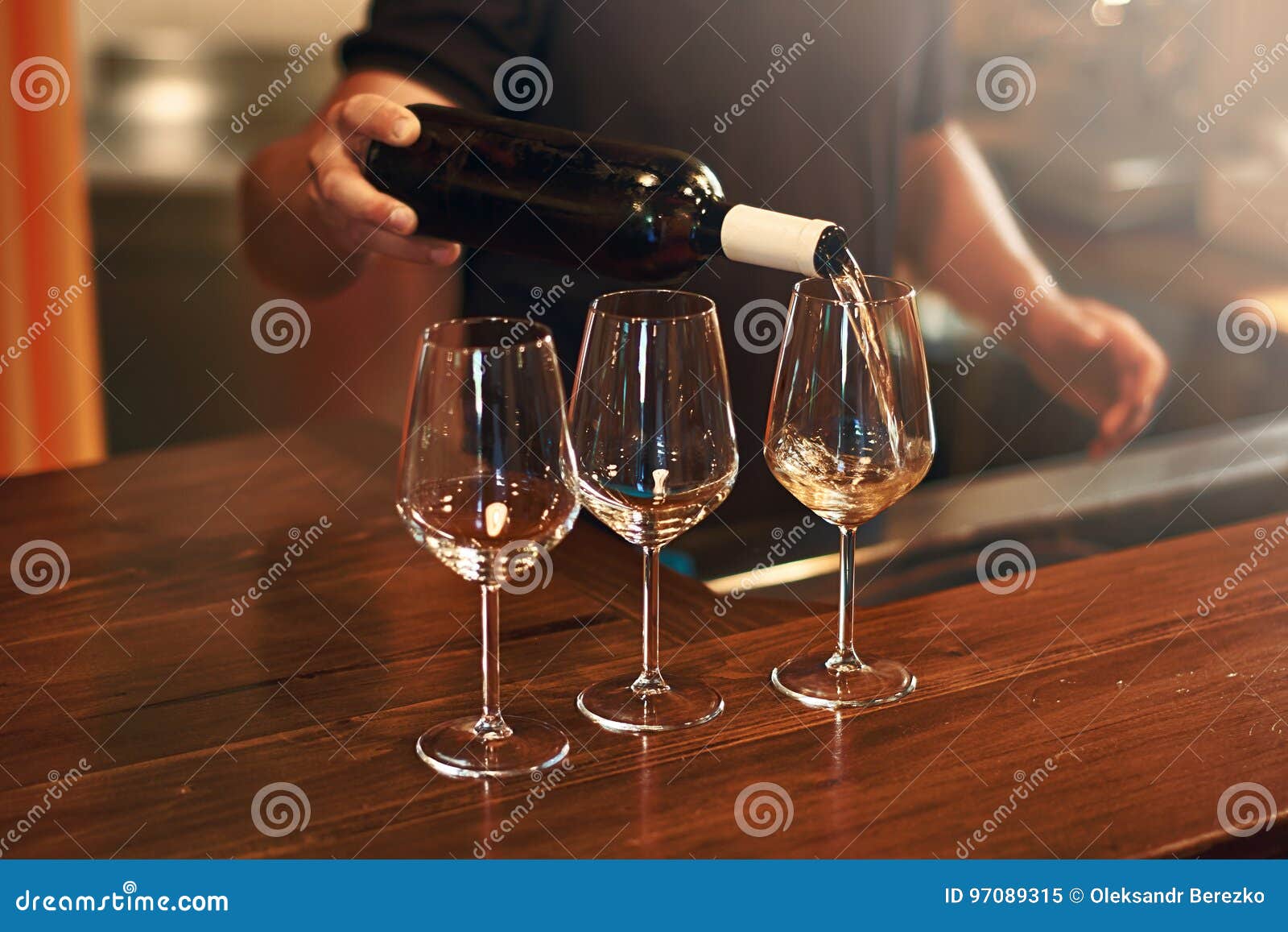 sommelier fills the glasses during pinot gris wine tasting