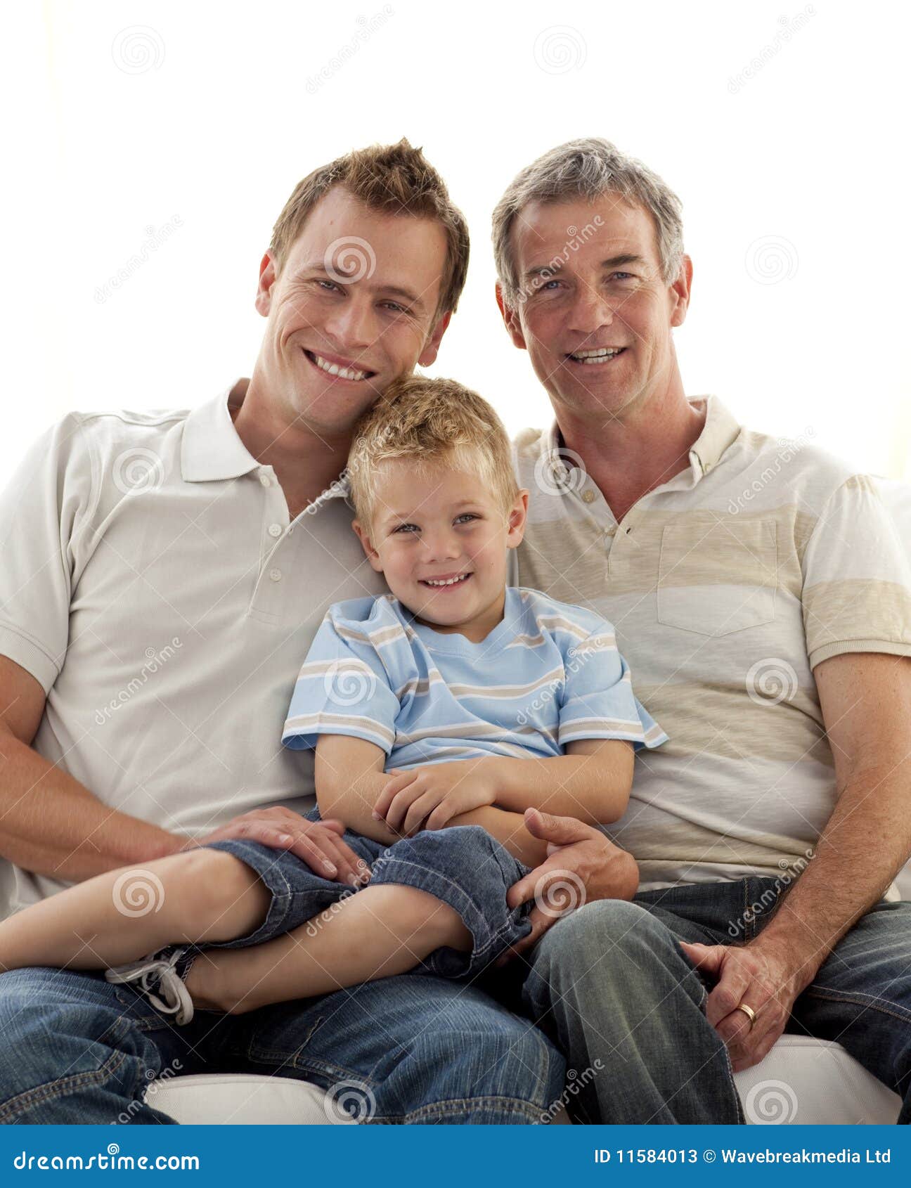 Son, Father And Grandfather Sitting On Sofa Royalty-Fre