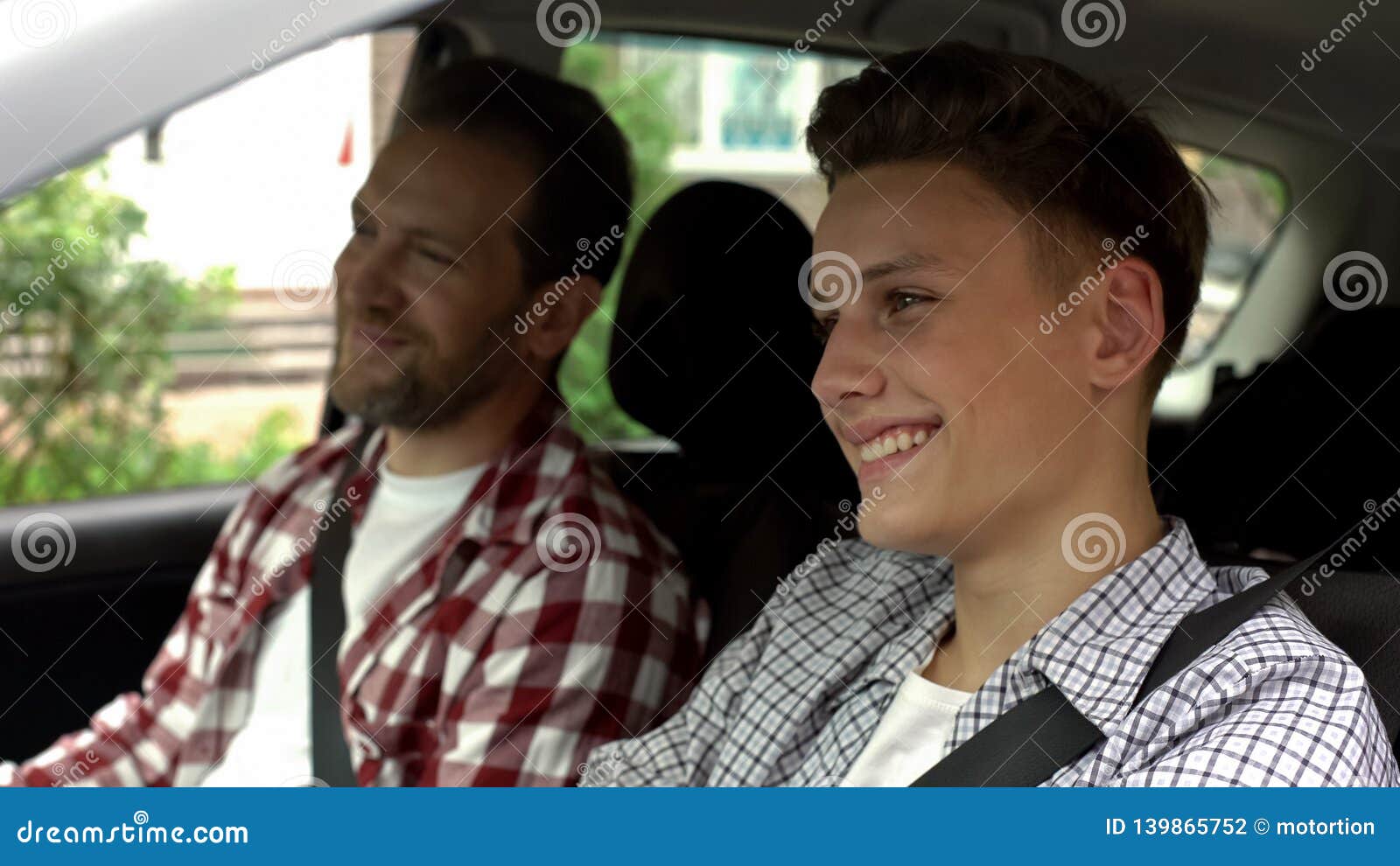 son with father testing new bought car, dad teaching teen boy to drive auto