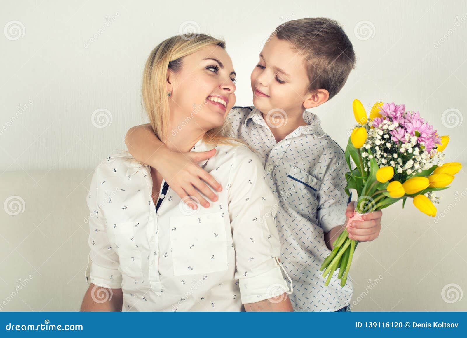 Son Gives His Beloved Mother A Beautiful Bouquet Of Tulipsthe Concept